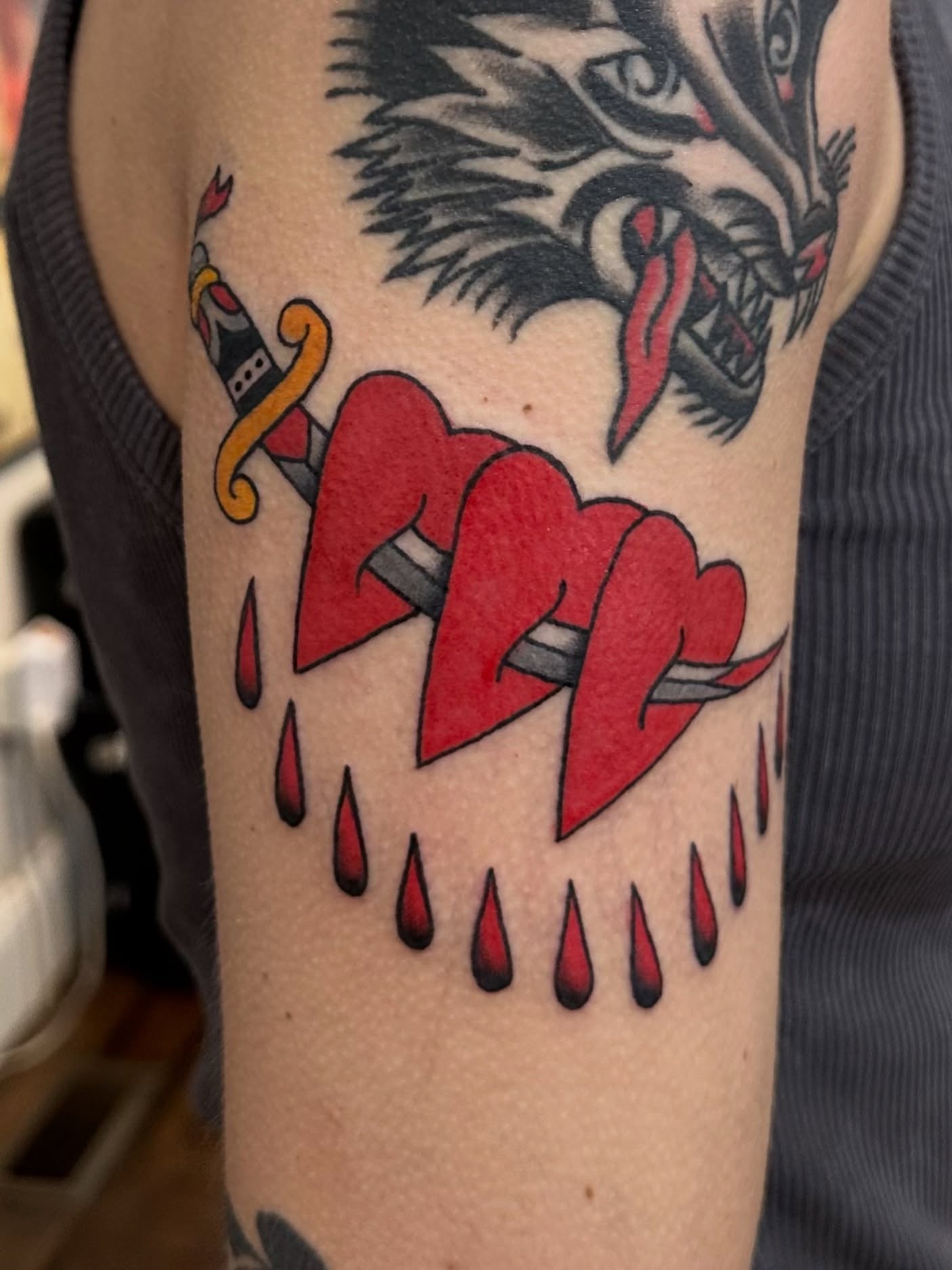 Broken hearts American traditional tattoo on the forearm by Stacy Fevinger