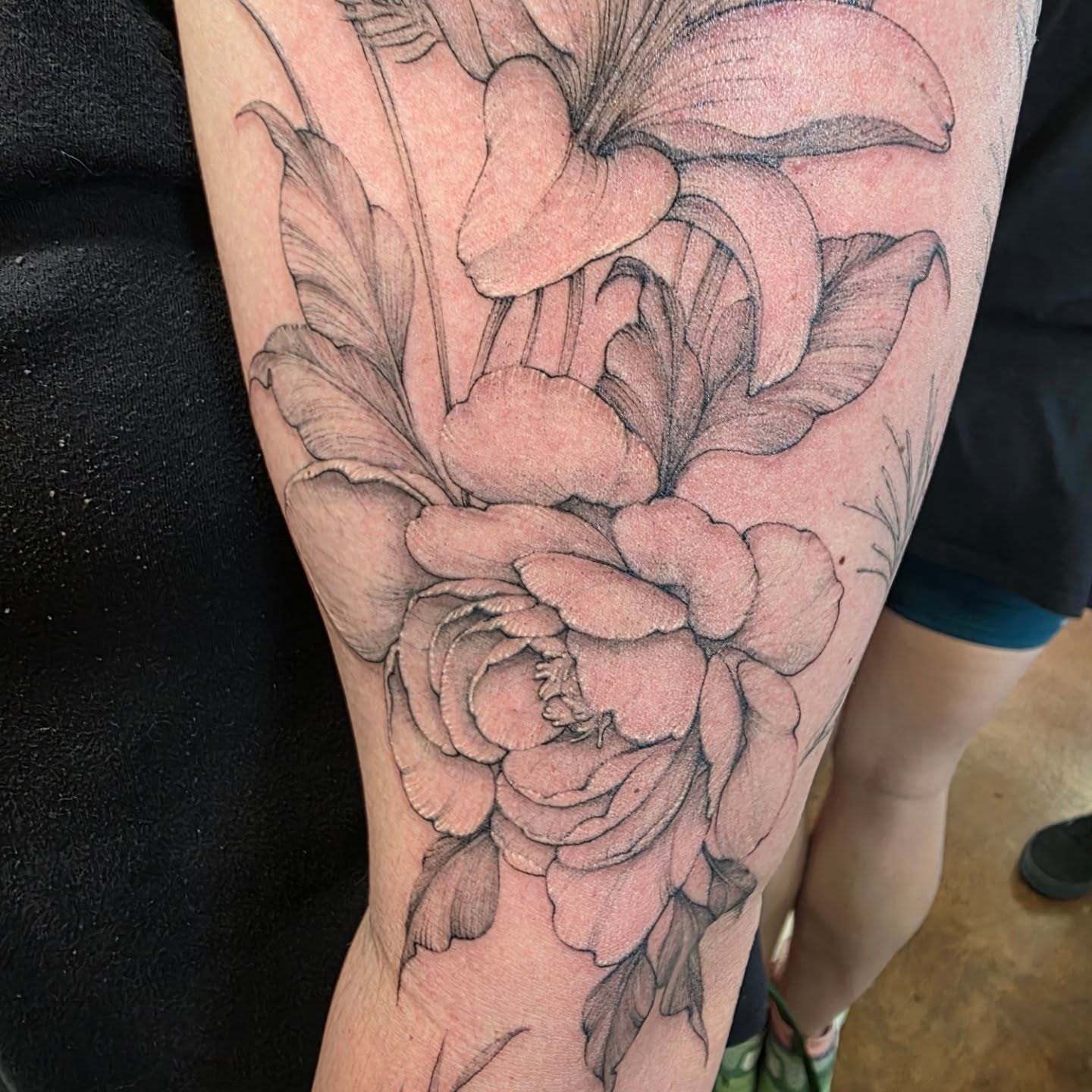 Flower bouquet realism tattoo on the forearm by Keith Countryman, Fort Worth, Texas