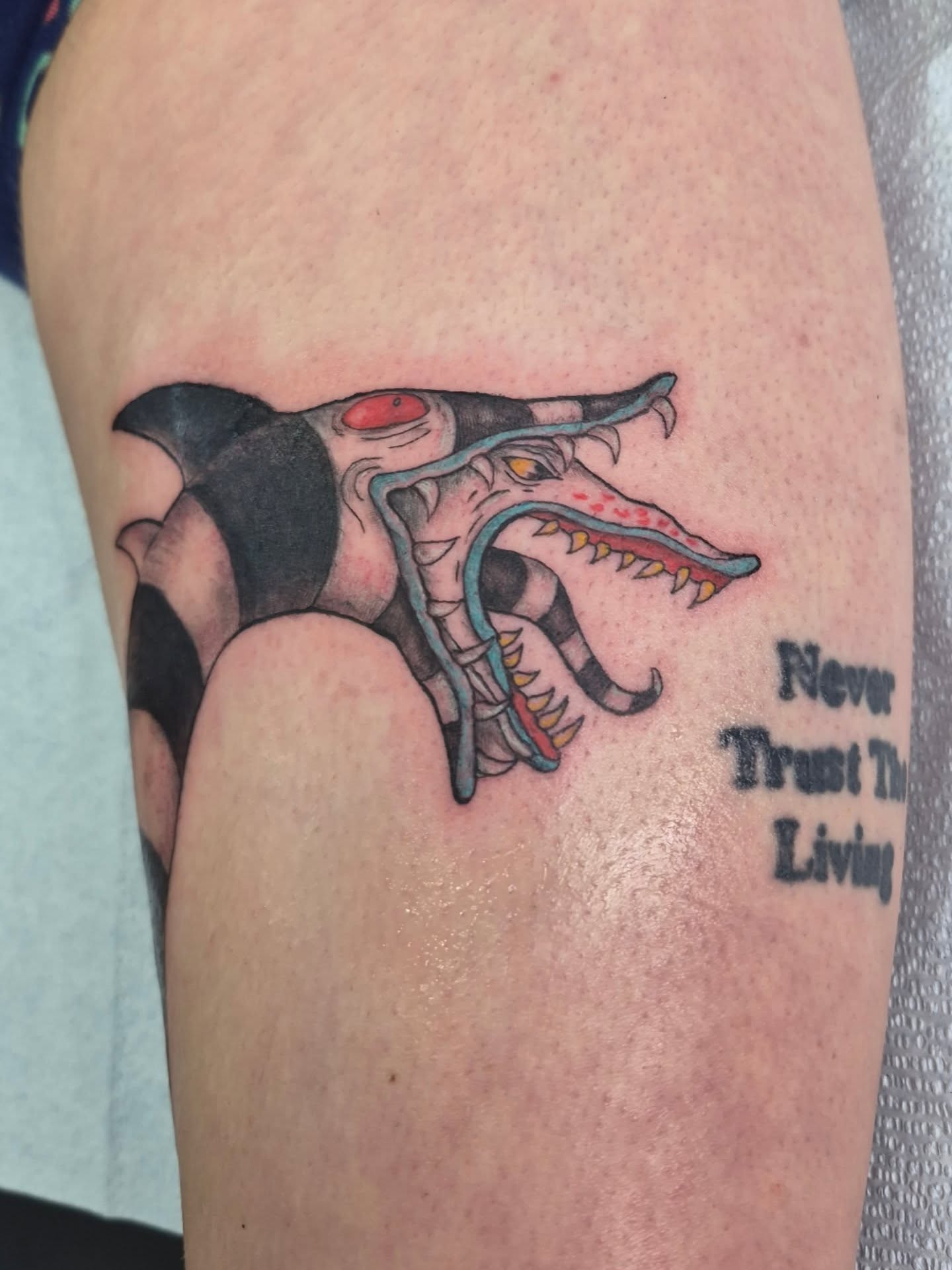 Cyborg dragon American traditional tattoo on the thigh by Chris Bell