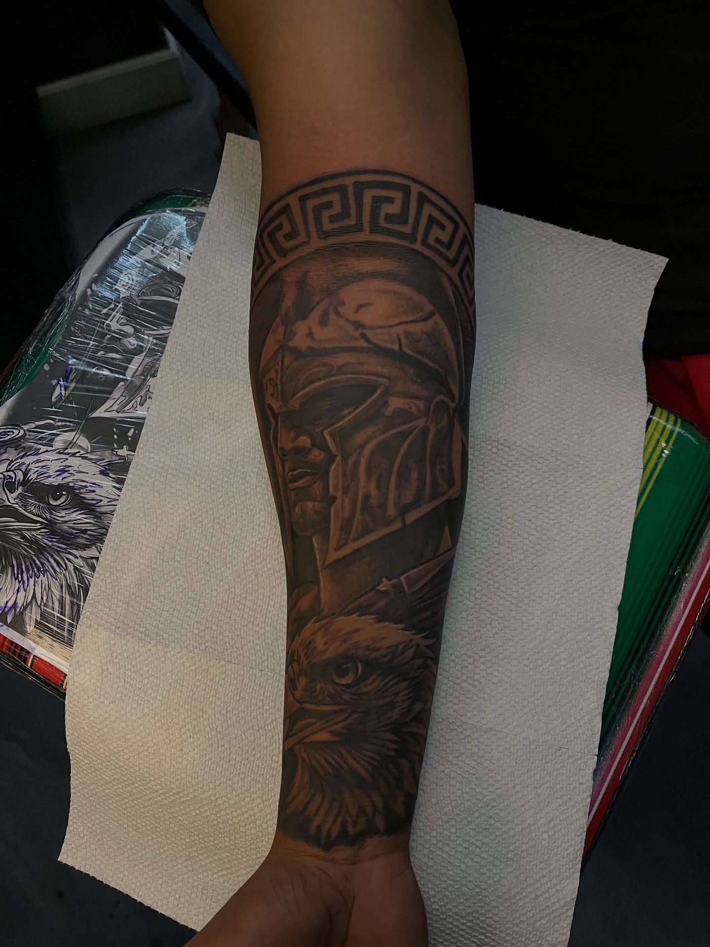 Helmeted warrior and eagle realism tattoo on the forearm by Dee