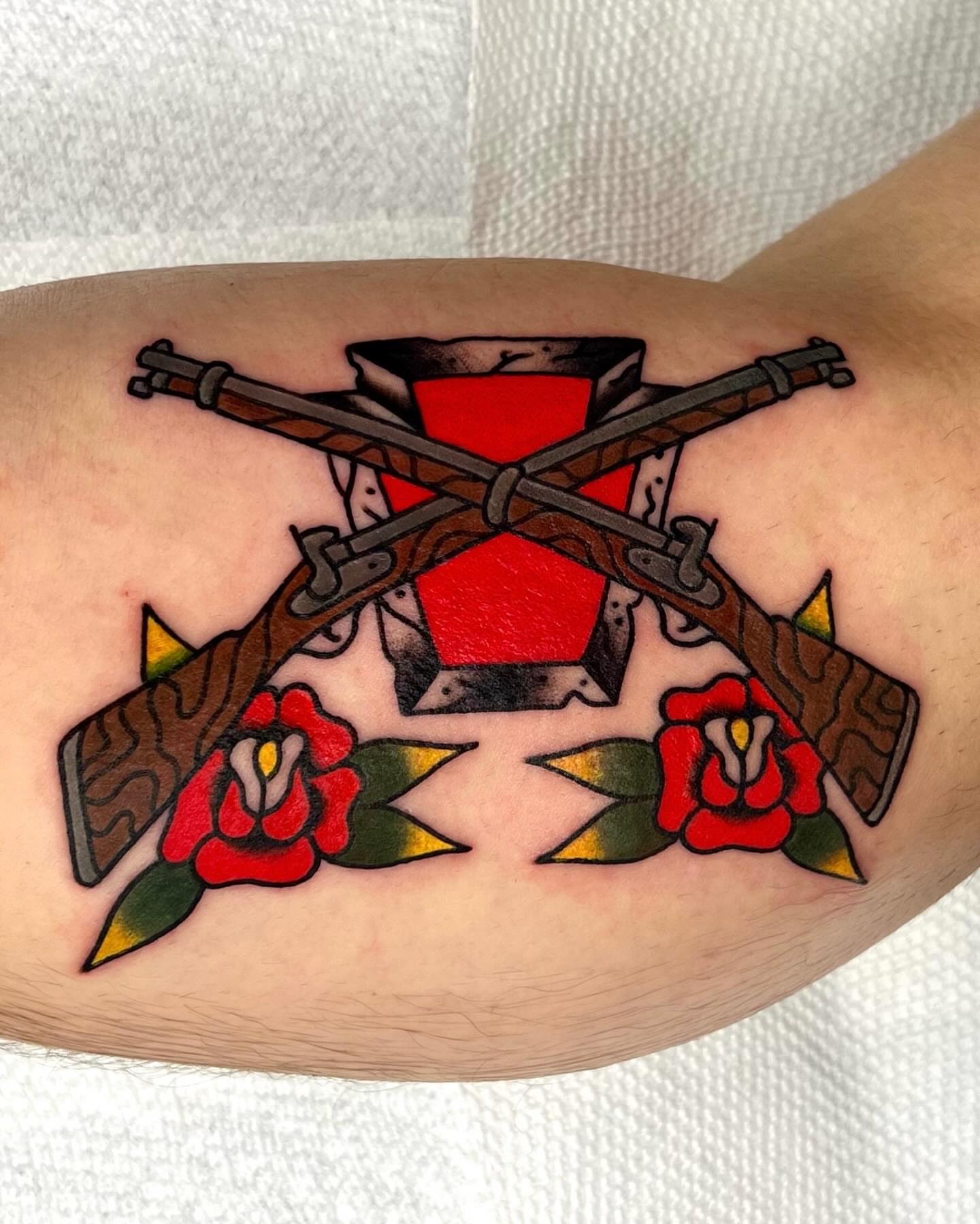Crossed rifles and roses American traditional tattoo on the forearm by 💧cry Bby💧