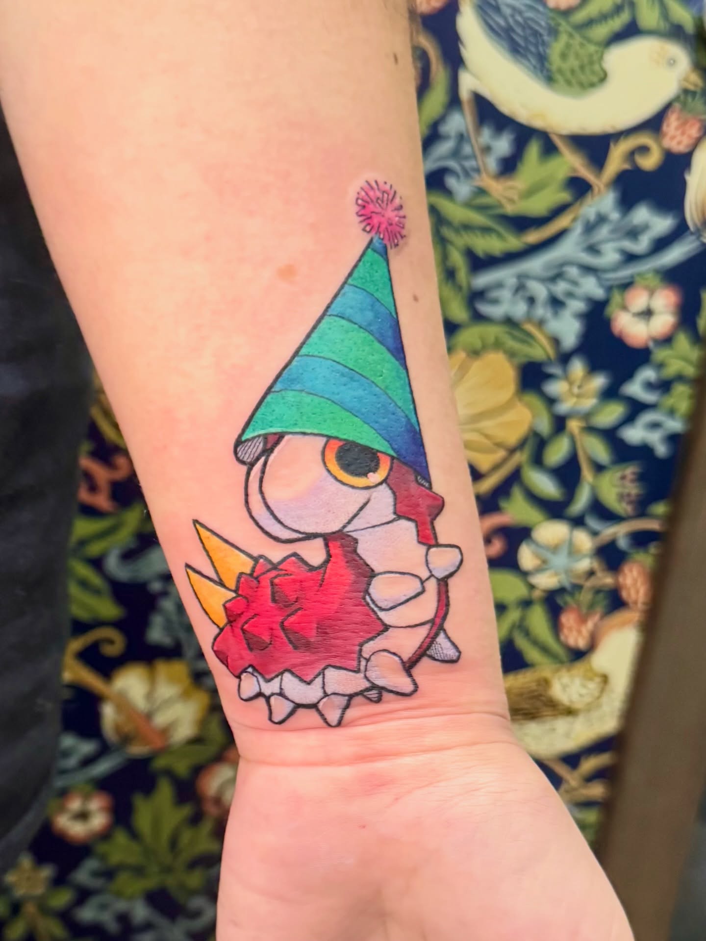Gnome with party hat new school tattoo on the forearm by Joey Topacio