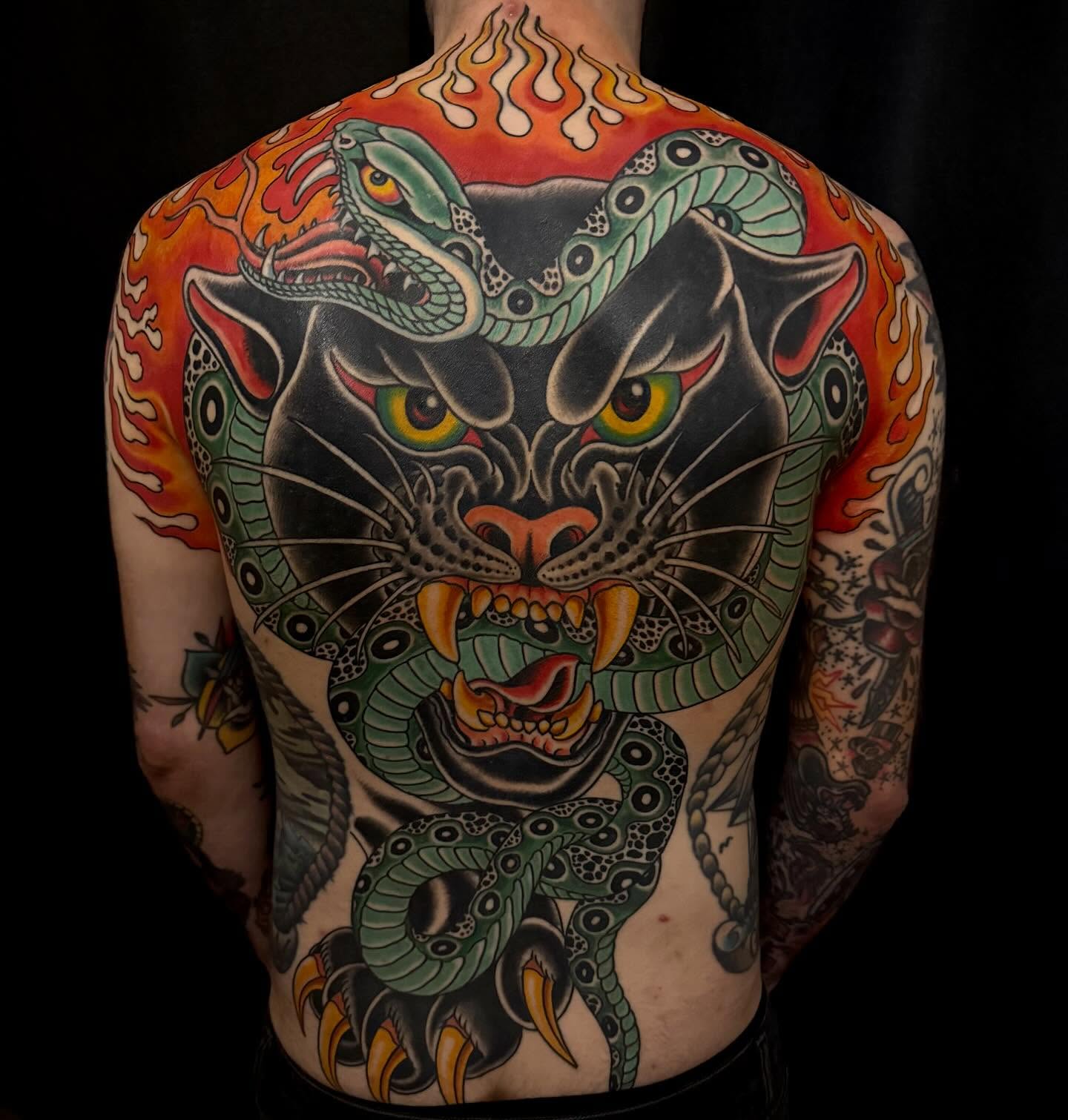 Panther and snake American traditional tattoo on the back by Adam Warmerdam, Los Angeles, California