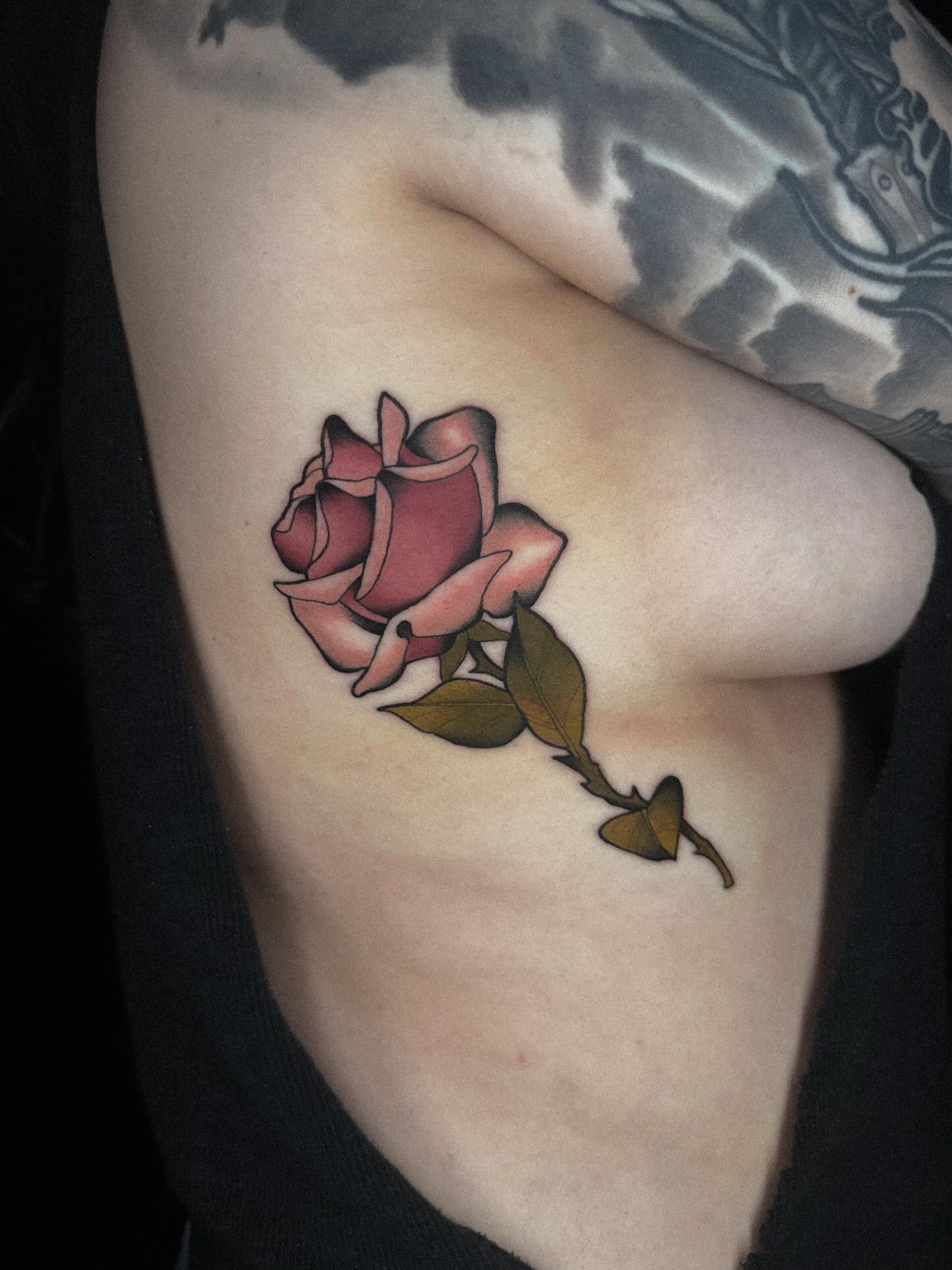 Rose realism tattoo on the ribs by Nathan Thomas