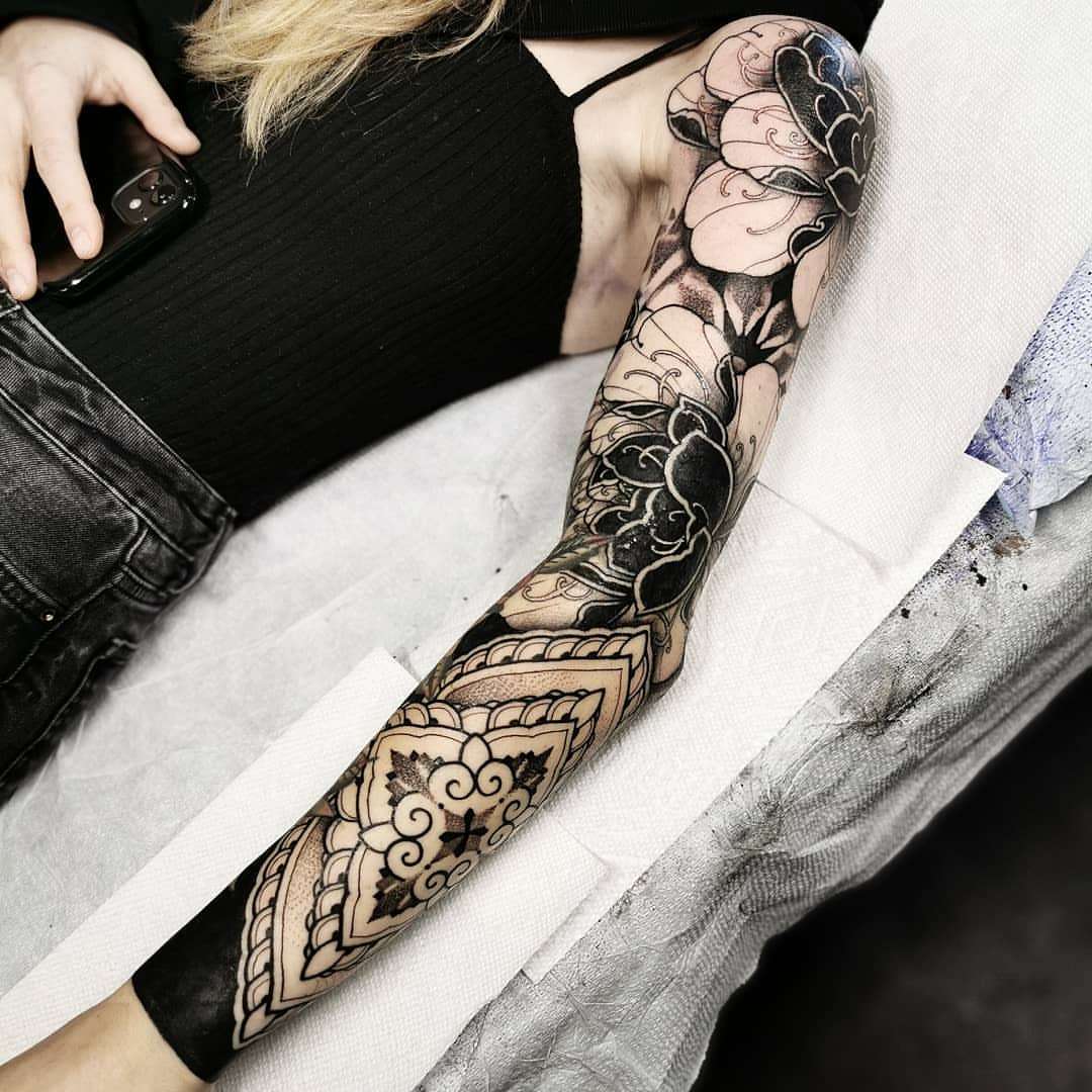 Floral mandala geometric tattoo on the forearm by miami tattoo artist