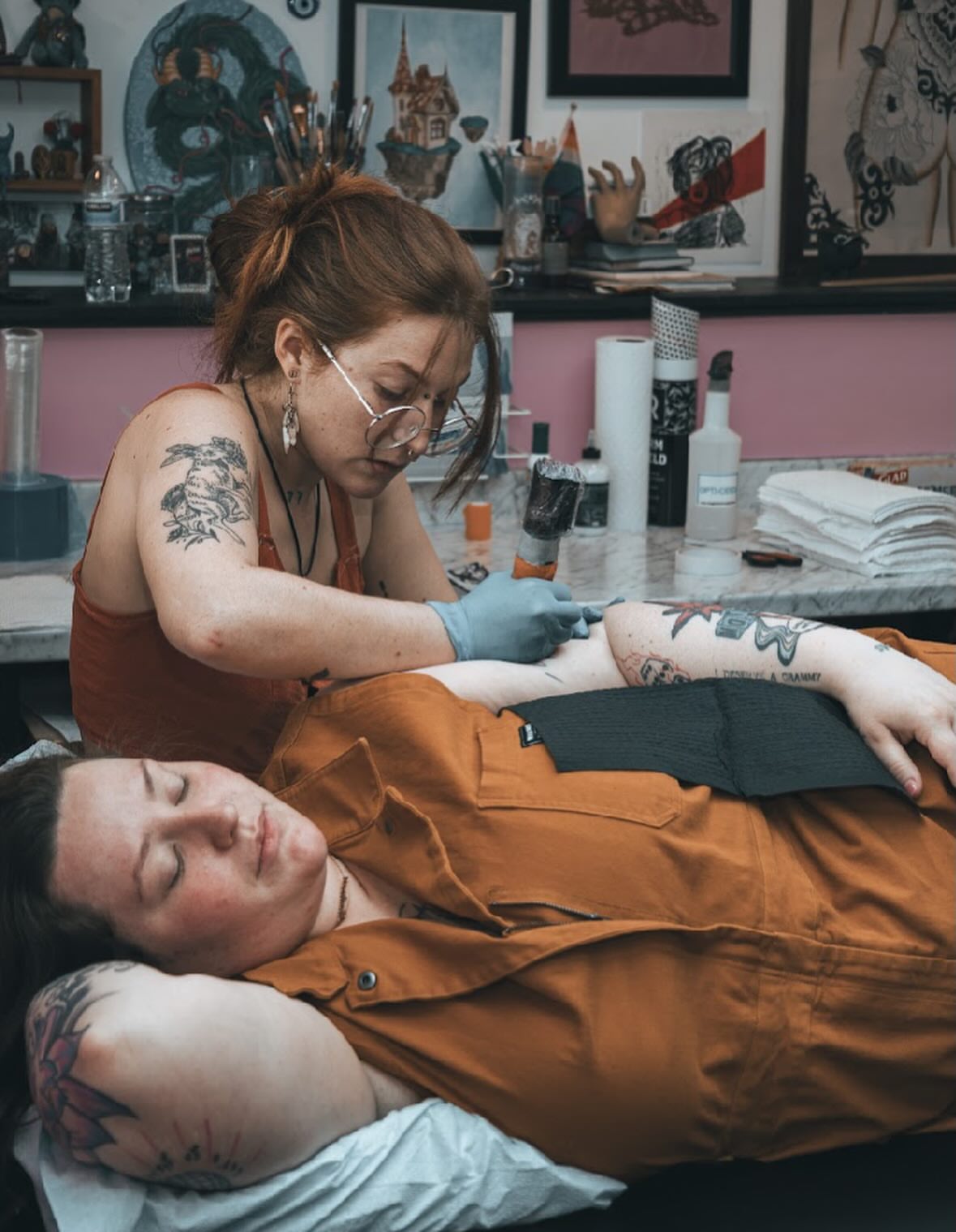 Tattoo artist and client American traditional tattoo on the torso by Lainy Lou