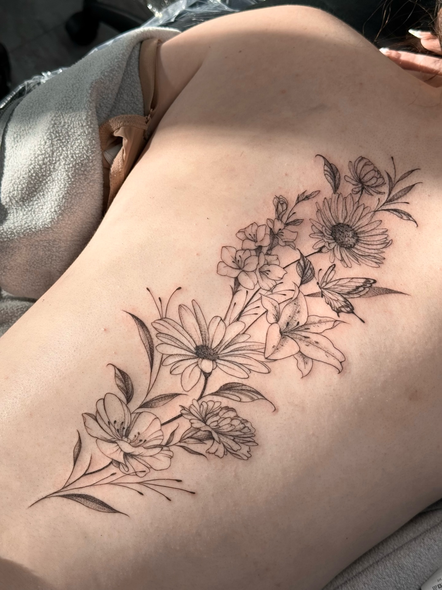 Tattoo by @pomaikai.artistry — black_and_grey