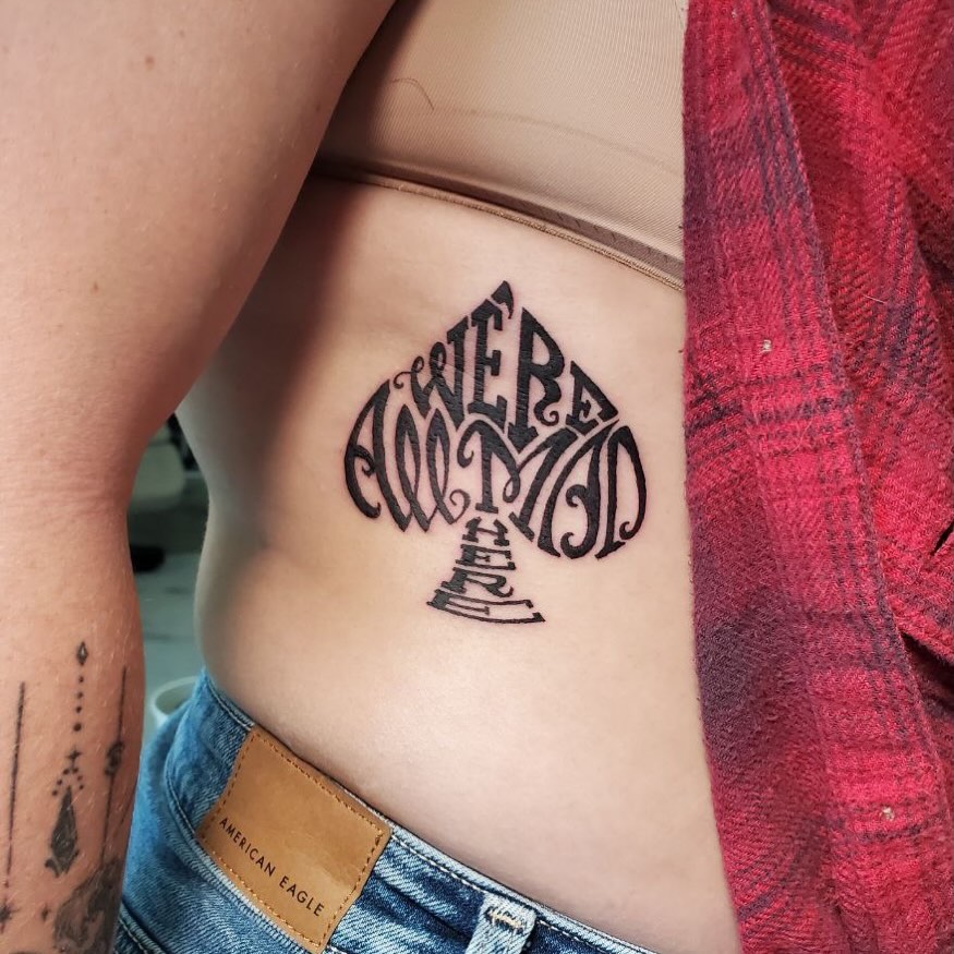 Lettering lettering script tattoo on the torso by Matthew Ray, Harrisburg, North Carolina