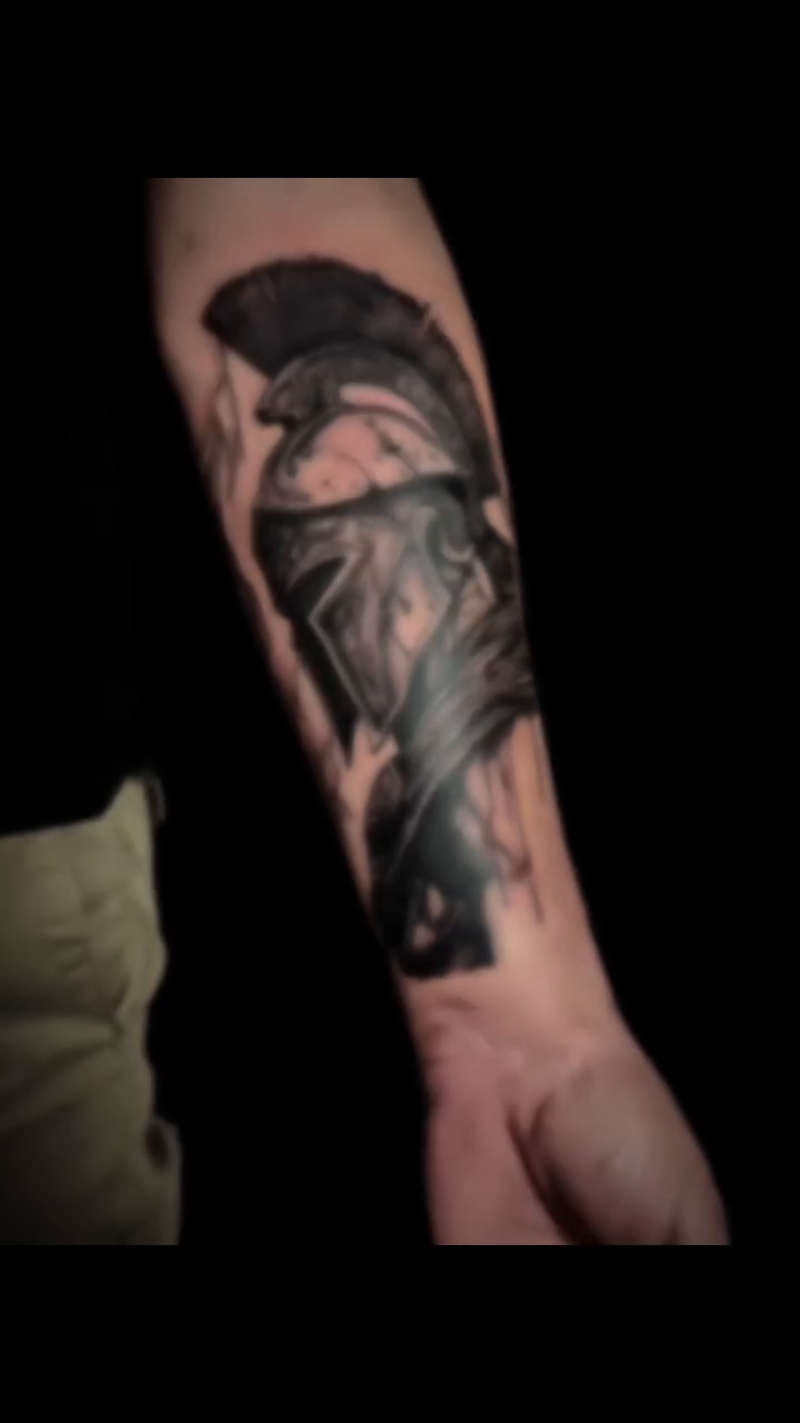Spartan helmet realism tattoo on the forearm by Juanma Martin