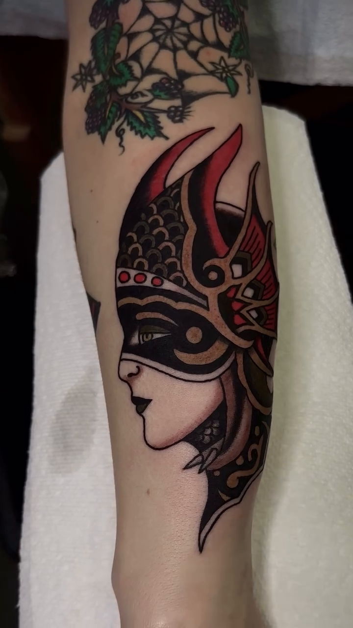 Woman in mask neo-traditional tattoo by Brandon Murphy