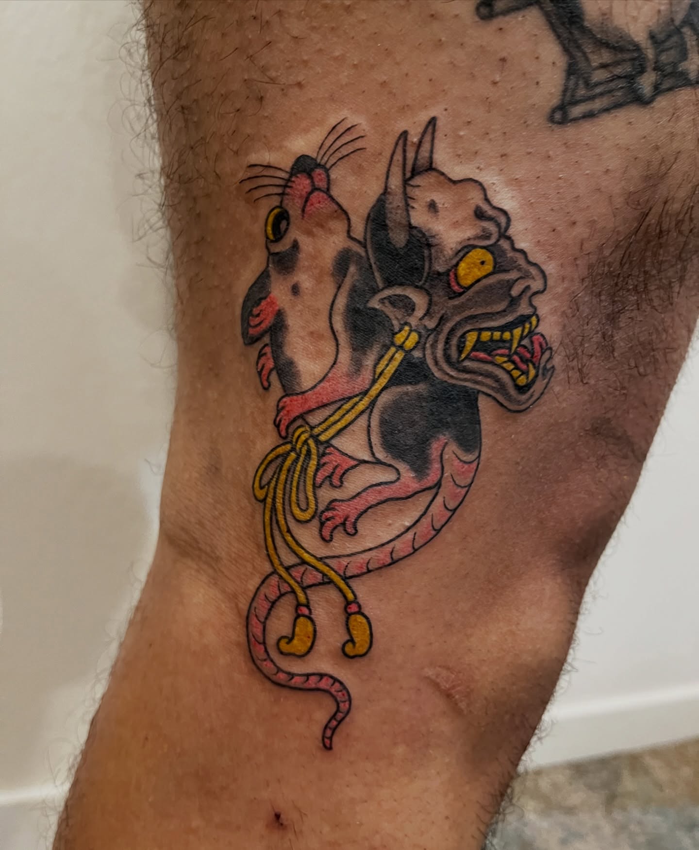 Rat and dragon American traditional tattoo on the forearm by Campbell Zane Alexander