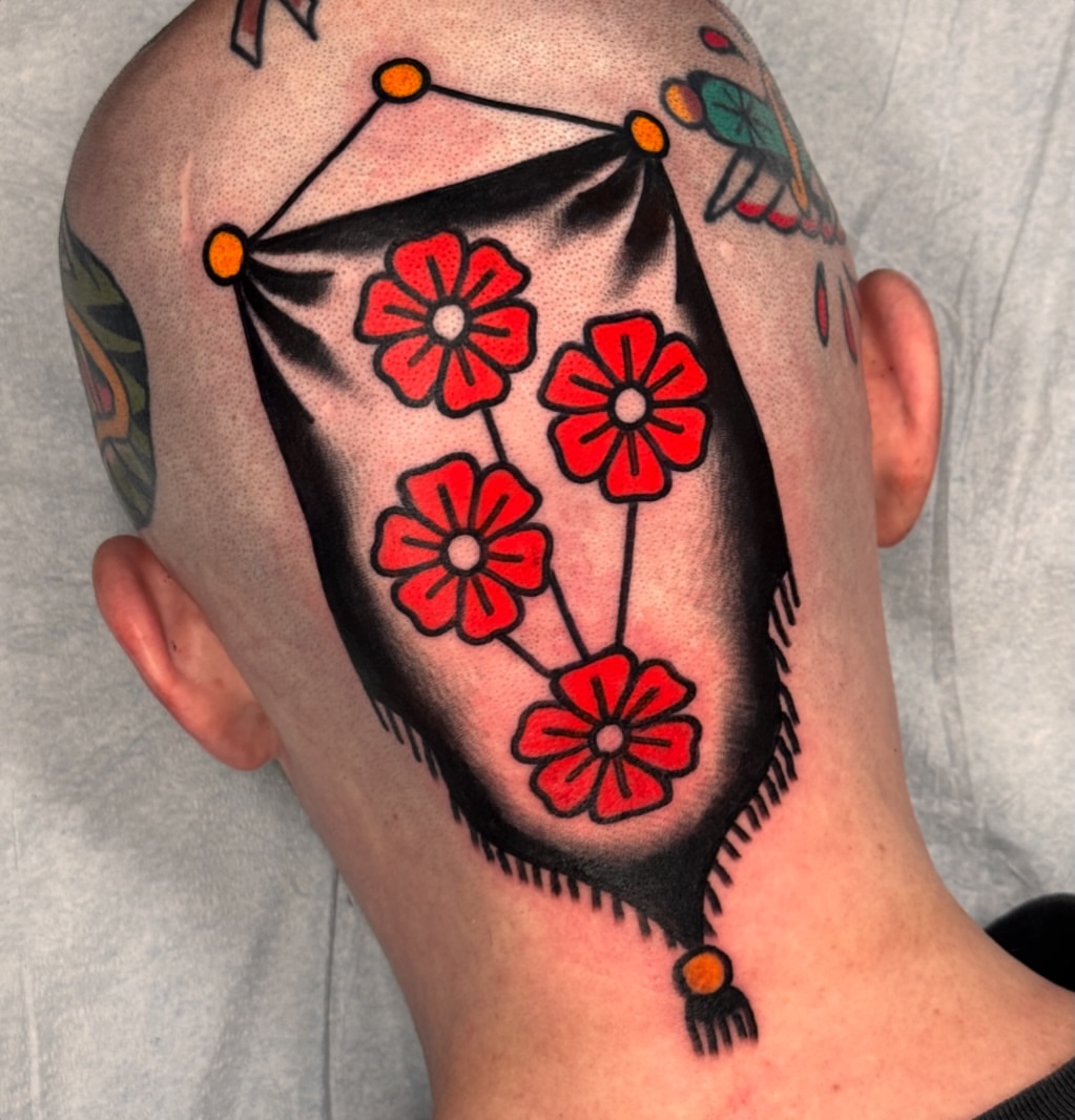 Red flowers American traditional tattoo on the head by Jess Baker
