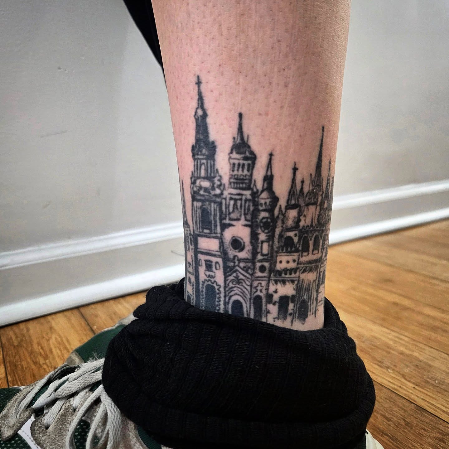 Castle black and grey tattoo on the forearm by julian