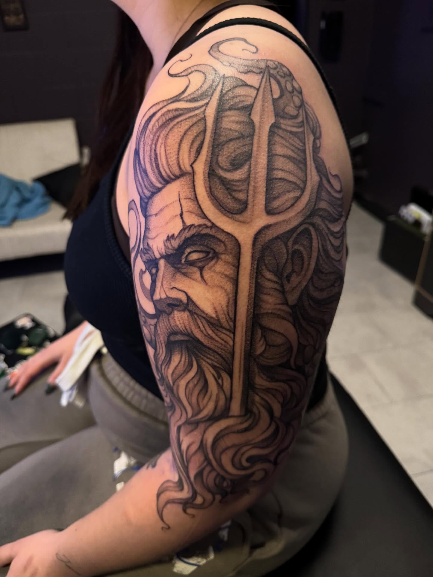 Godly figure realism tattoo on the shoulder by Lindsay