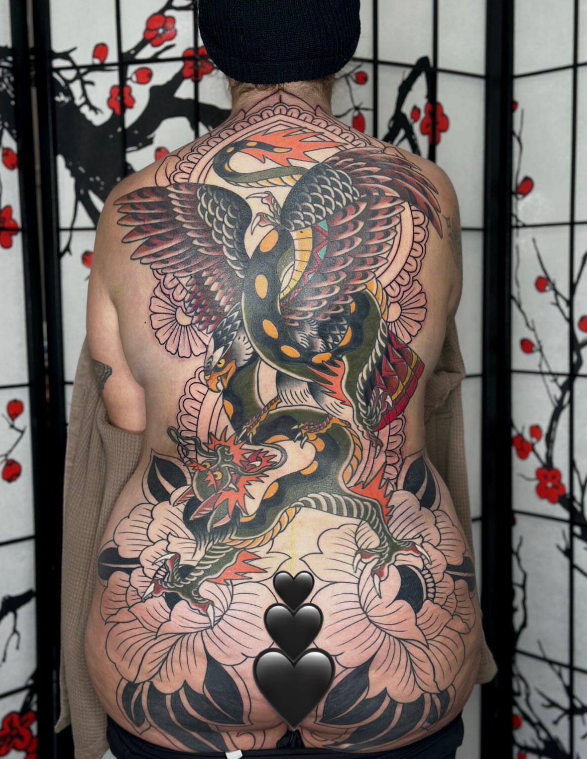 Bird and dragon American traditional tattoo on the back by Kat Fishbein