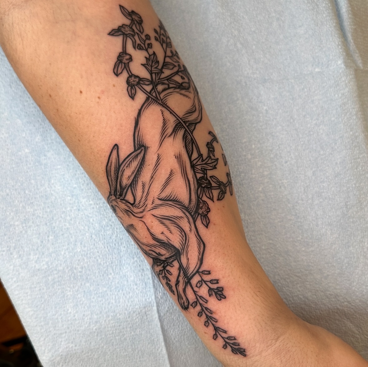 Horse and floral realism tattoo on the forearm by rosalie