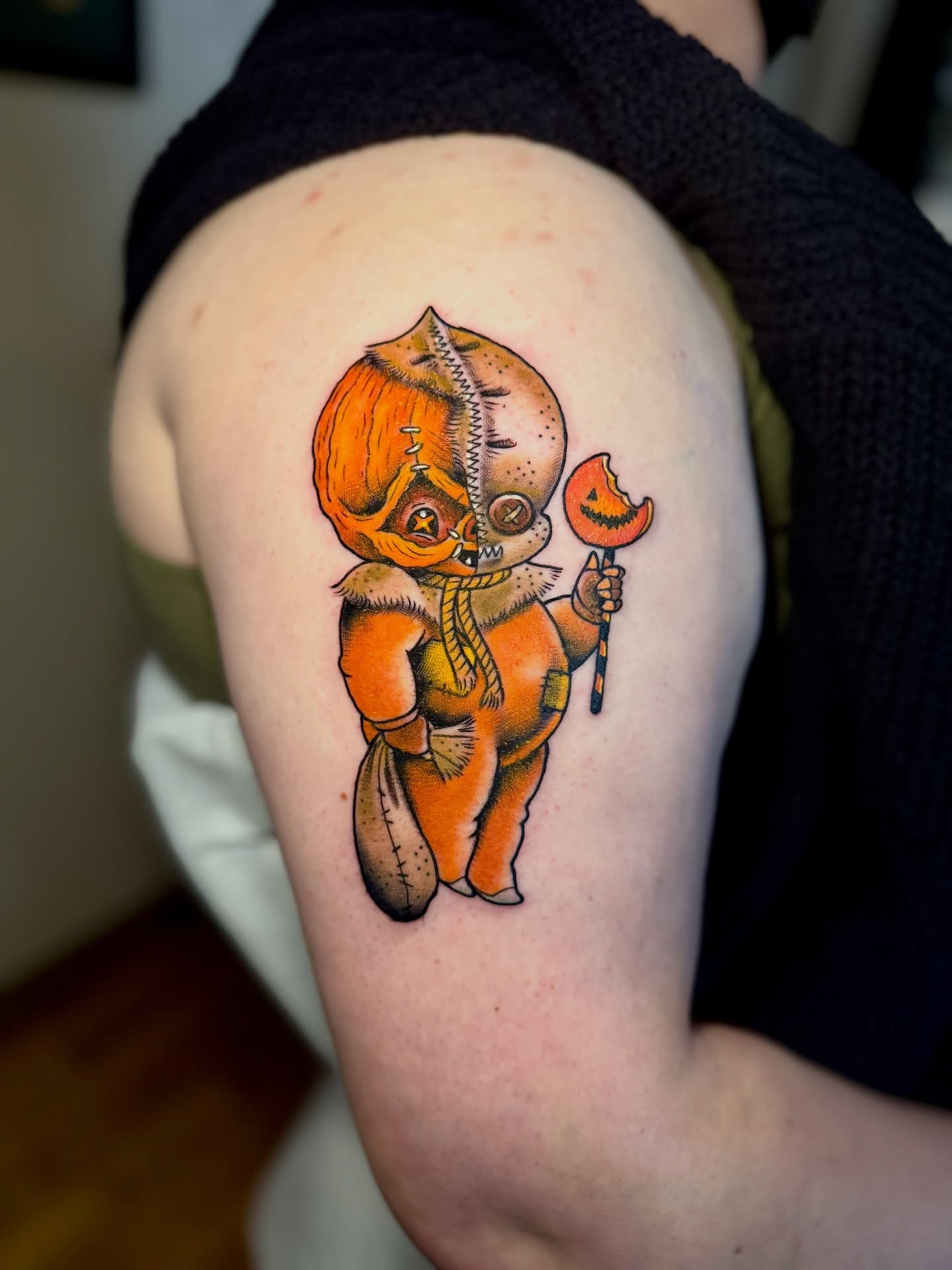 Pumpkin baby American traditional tattoo on the upper arm by Stacey Martin Smith
