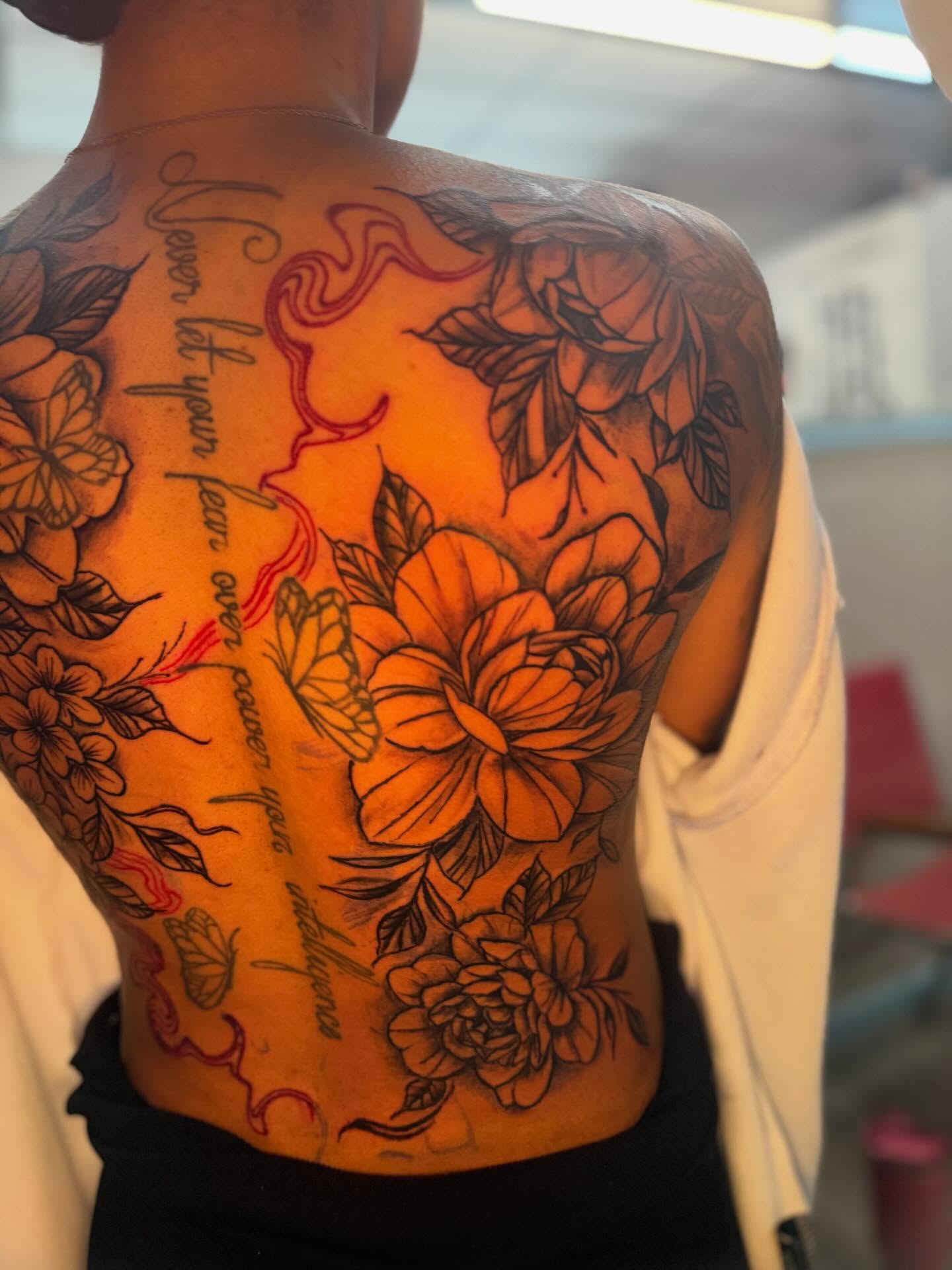 Floral bouquet neo-traditional tattoo on the back by JAE, Shreveport, Louisiana