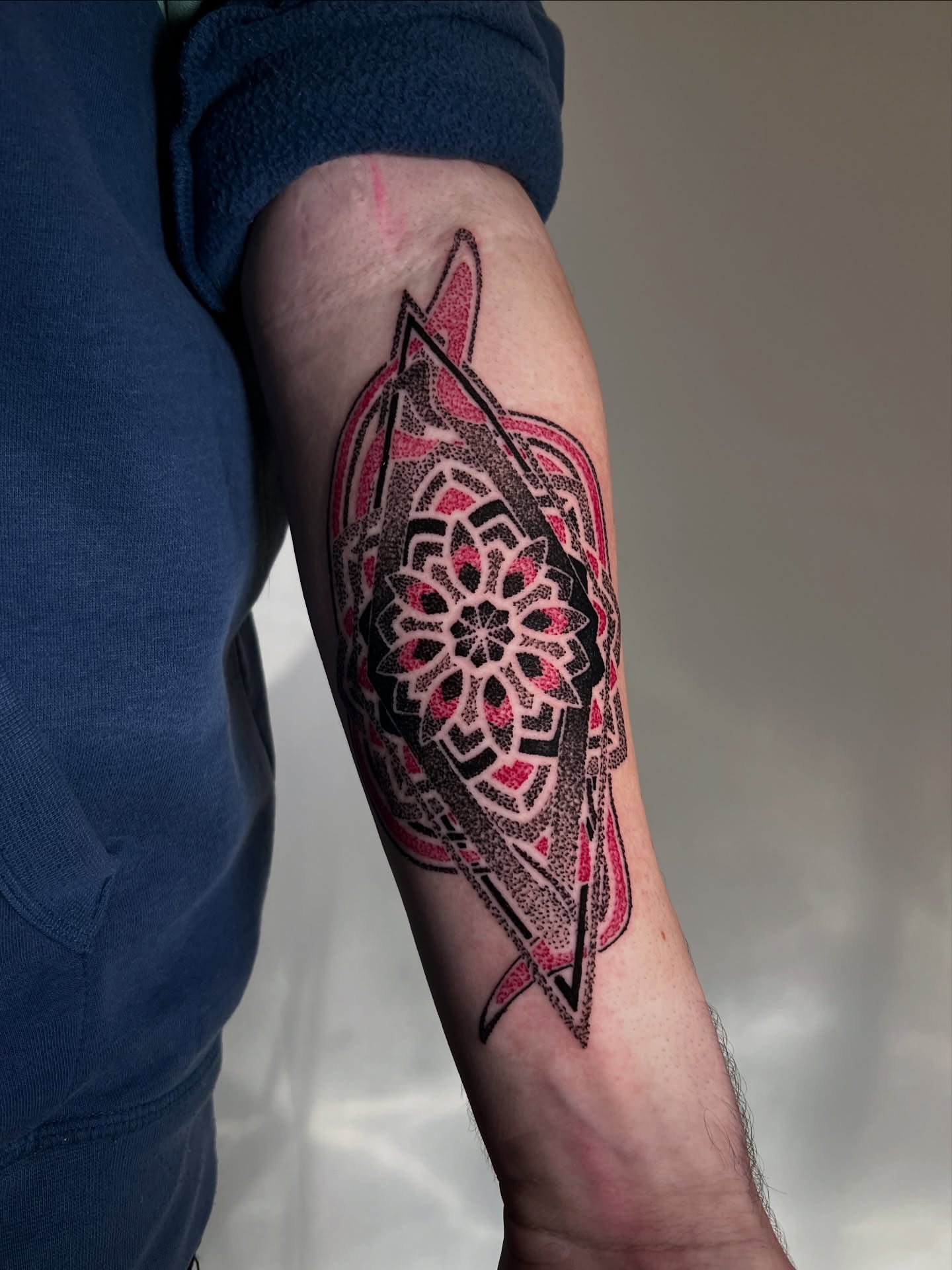 Mandala dotwork tattoo on the forearm by Riley