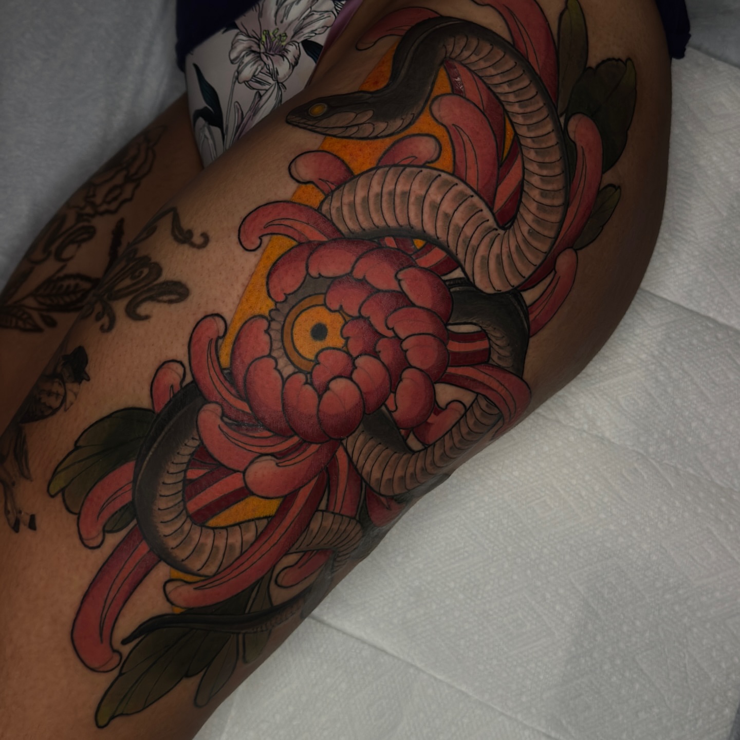 Snake and peony japanese irezumi tattoo on the thigh by Golden Heart Tattoo Co