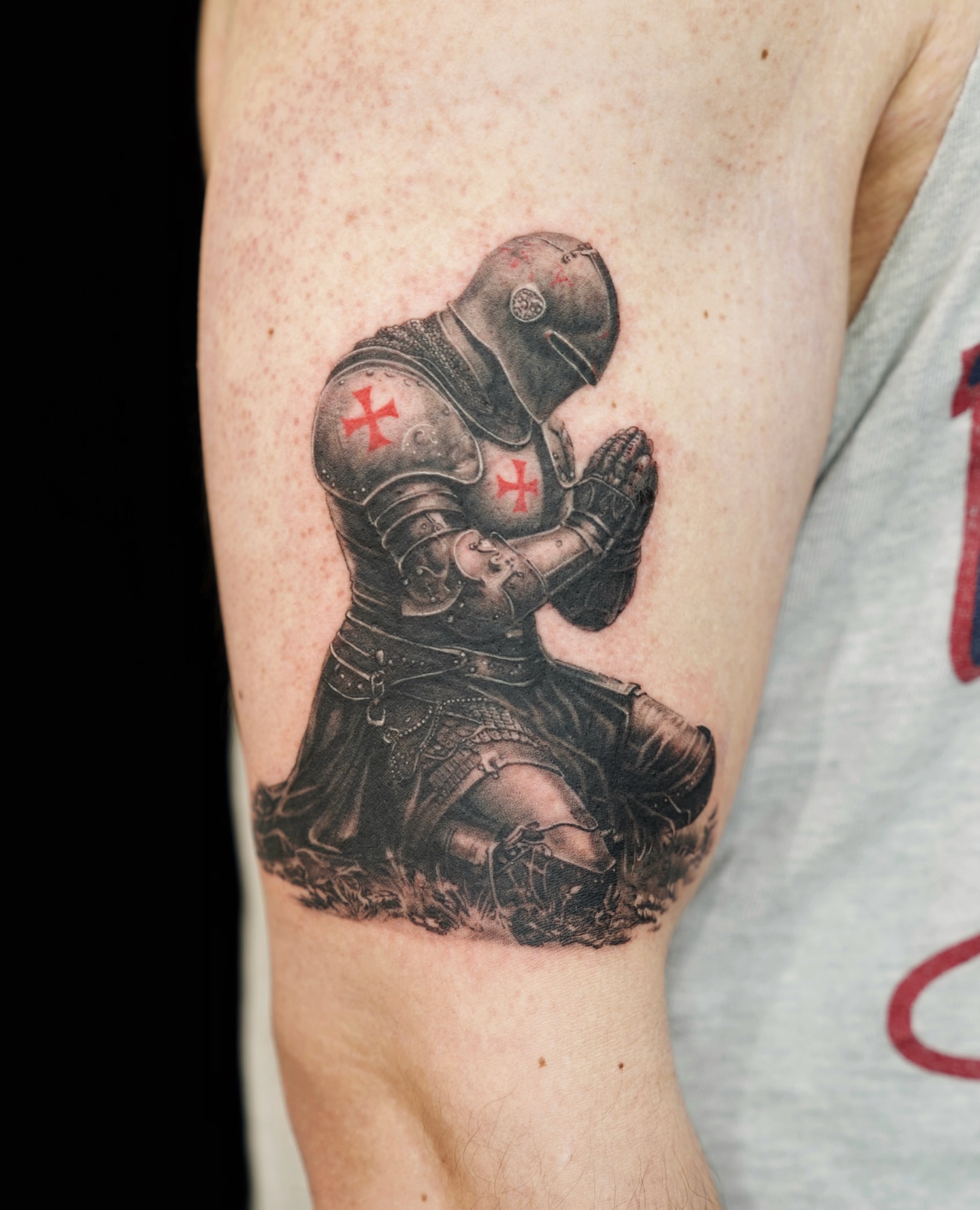Knight praying realism tattoo on the forearm by Gen Li