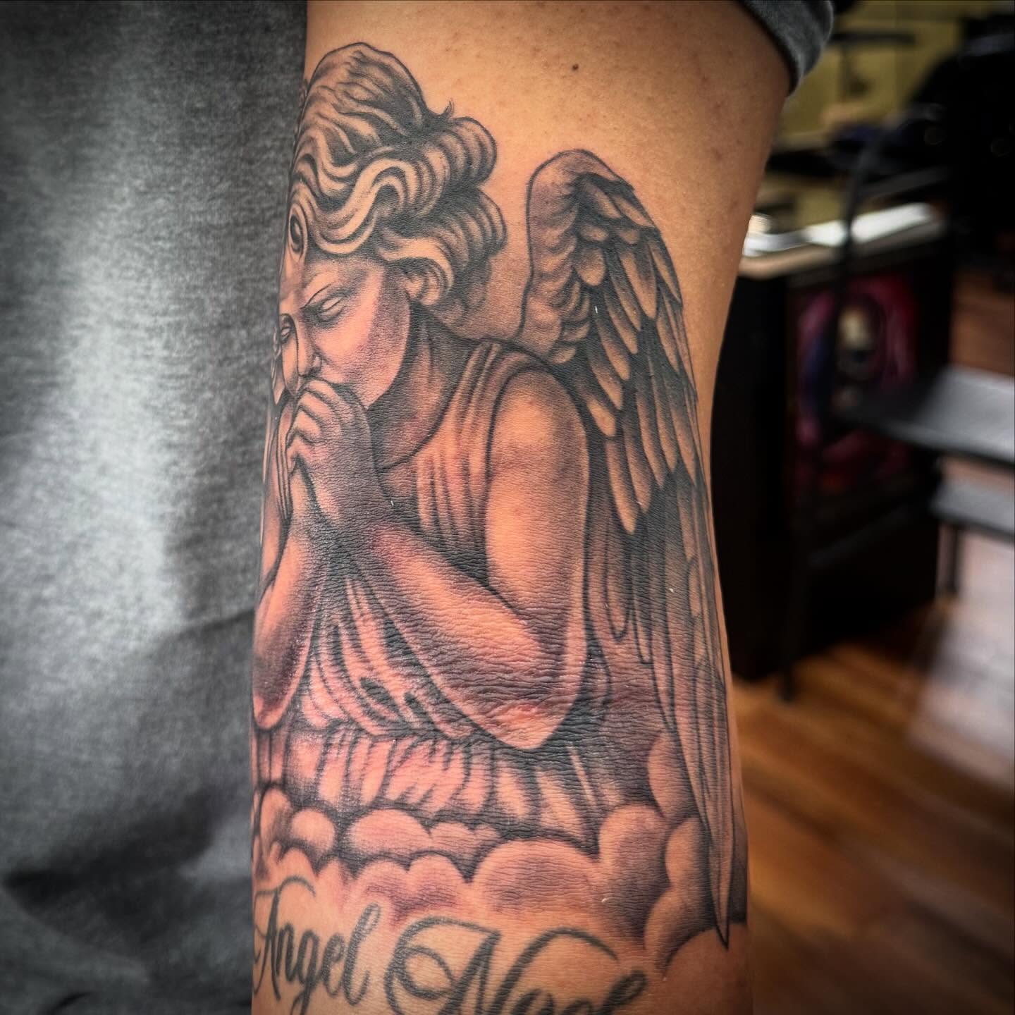 Angel realism tattoo on the forearm by Tanner Pastor