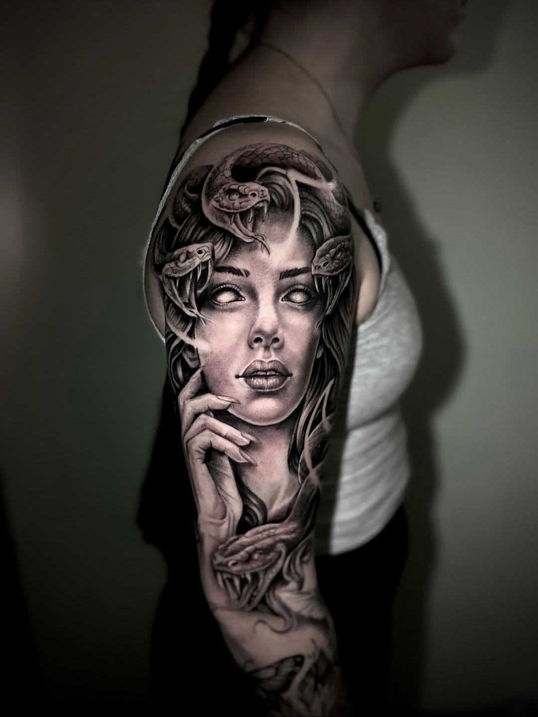Medusa with snakes realism tattoo on the forearm by Dylan Stevens