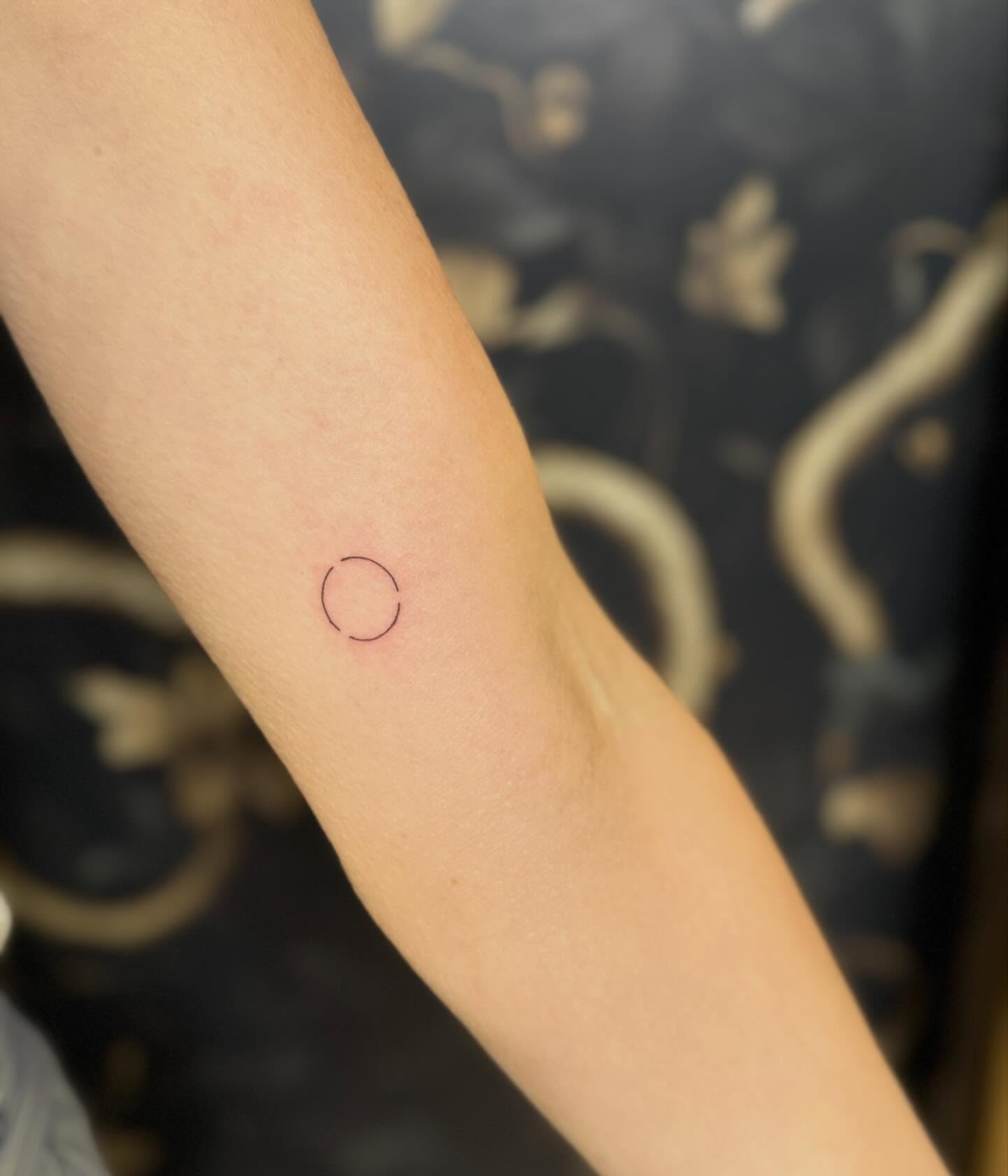 Circle minimalist tattoo on the forearm by Fineline Tattoos π€ Hailey L.