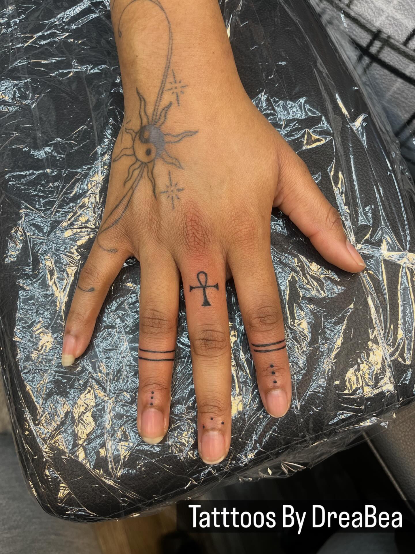 Sun and yin-yang black and grey tattoo on the hand by XoXandrea.Ink, Kansas City, Missouri