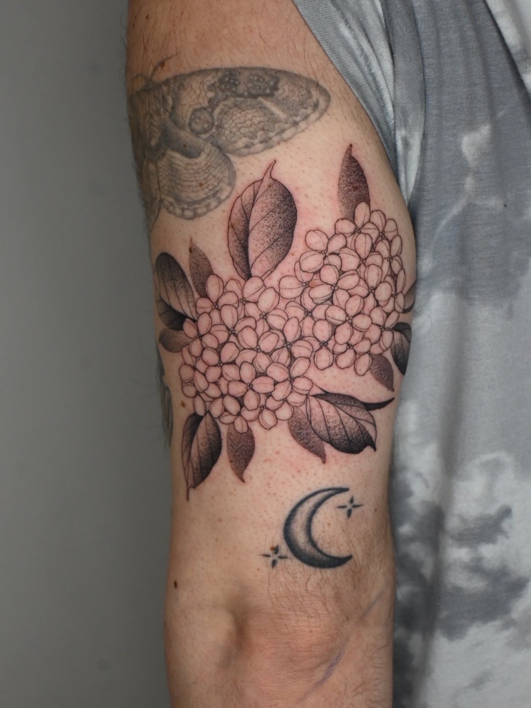Hydrangea and moon dotwork tattoo on the forearm by Simba Nguyen