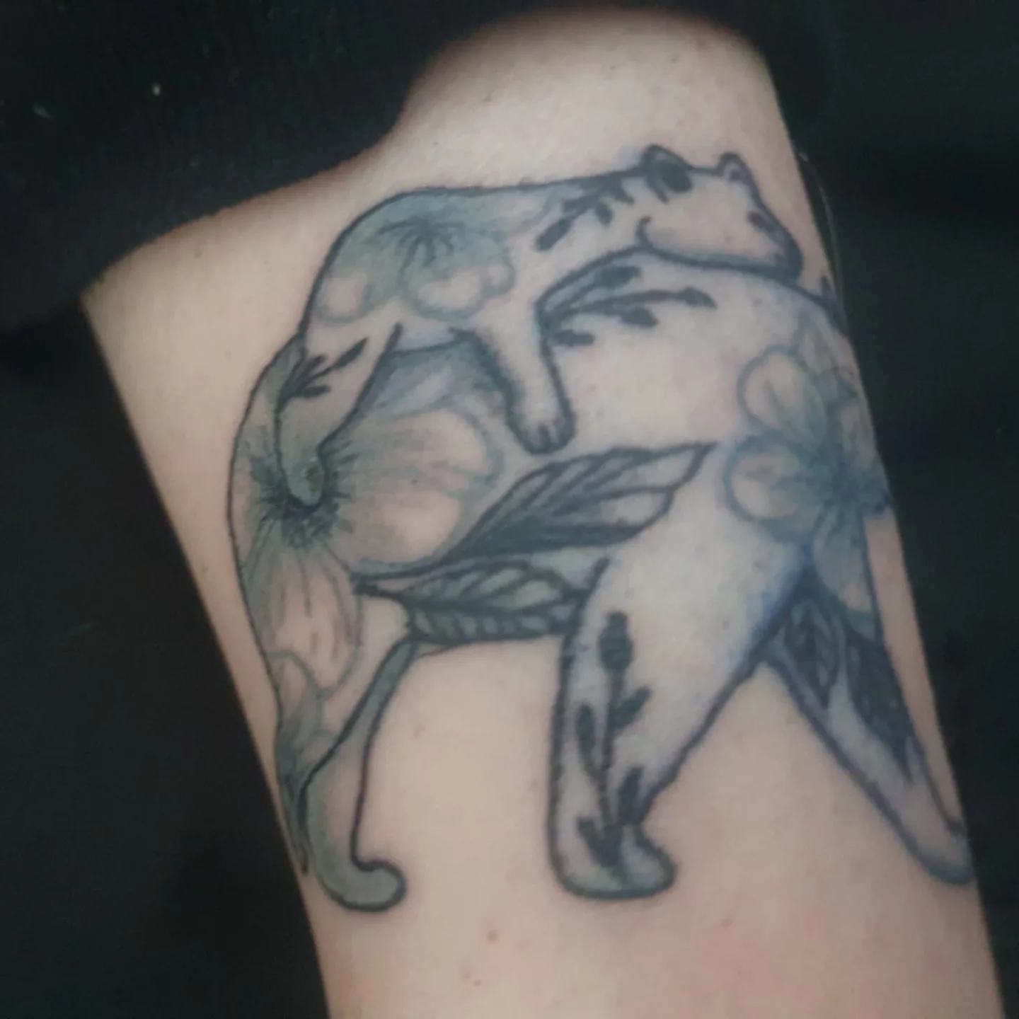 Cat black and grey tattoo on the thigh by Artful Ink