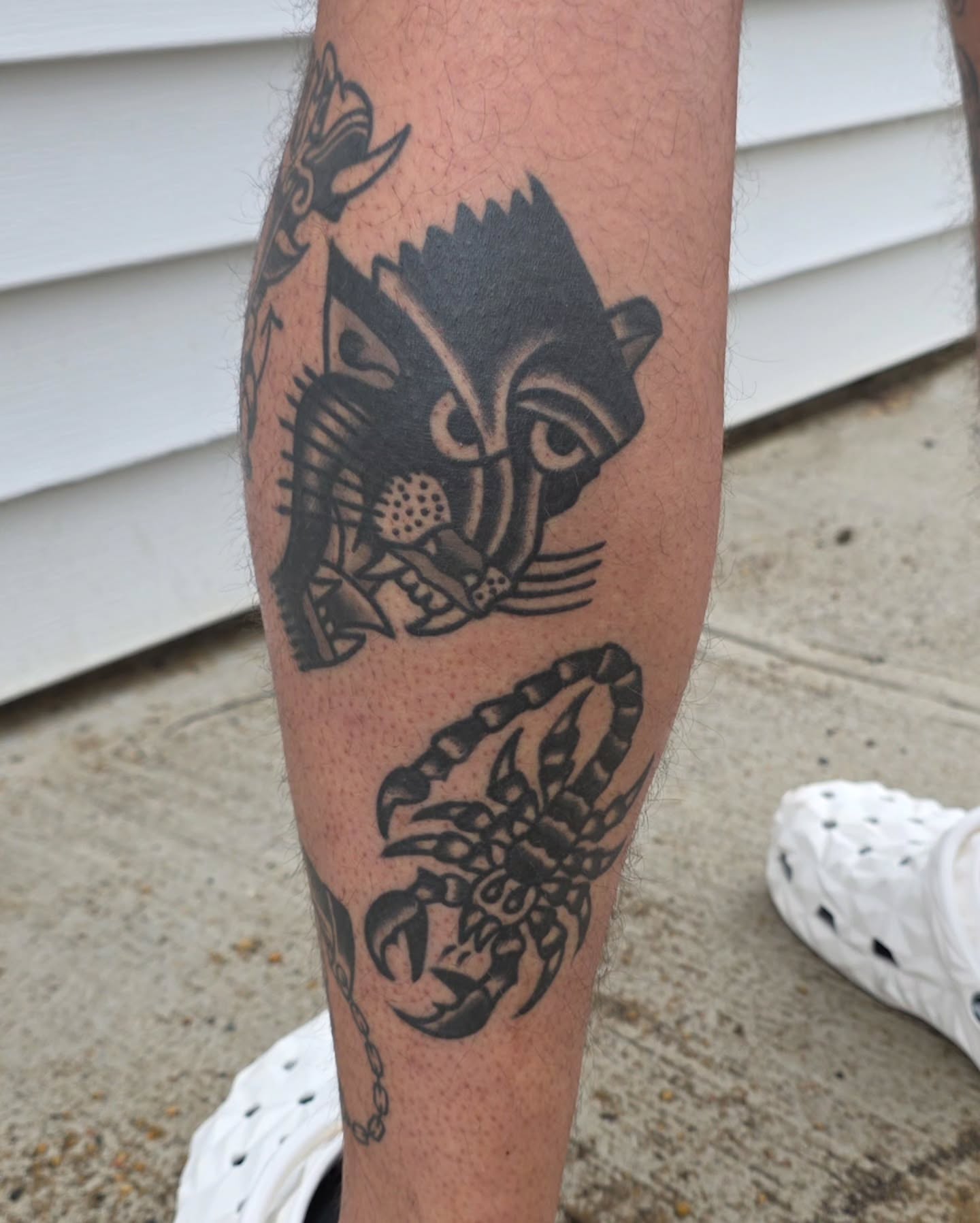 Scorpion and mask black and grey tattoo on the forearm by J. Kirsch New Jersey Tattoo Artist