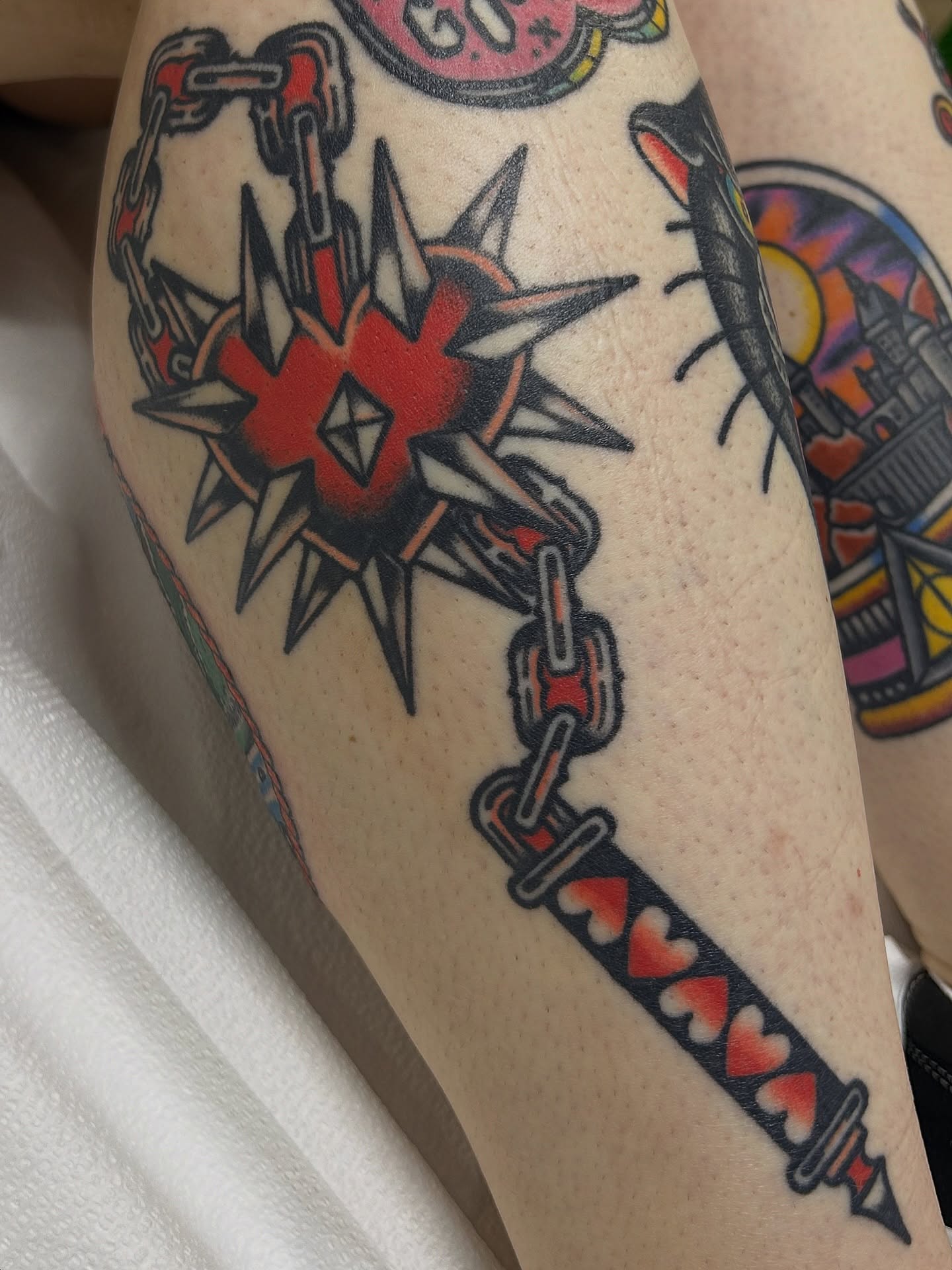 Heart with spikes American traditional tattoo on the forearm by Lauren Alexandra
