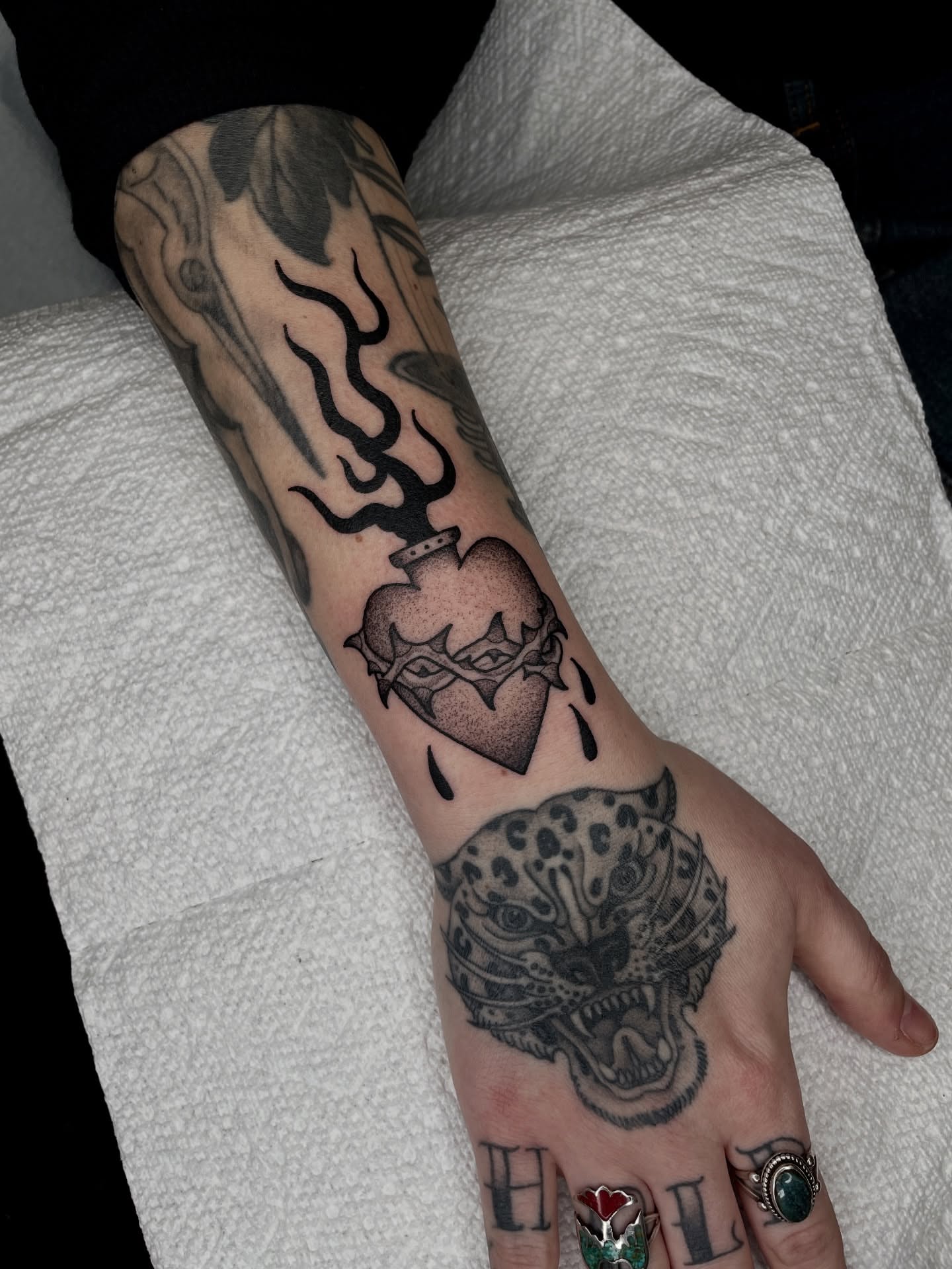Heart with crown black and grey tattoo on the forearm by Emily Lux