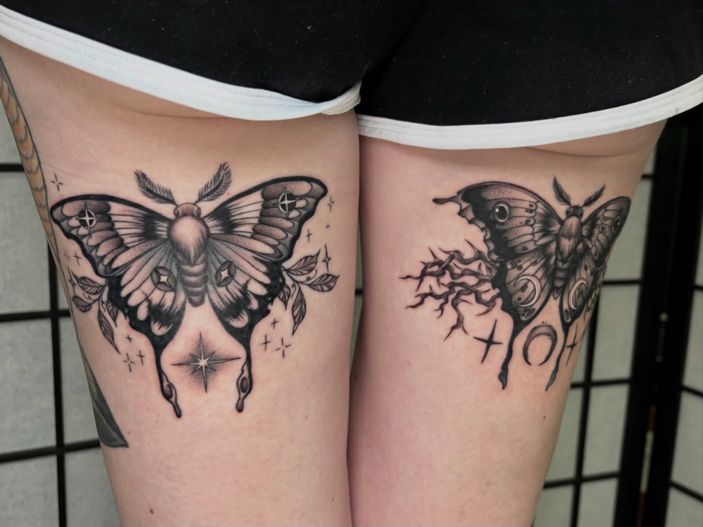 Moths and stars realism tattoo on the thigh by hannah vertal
