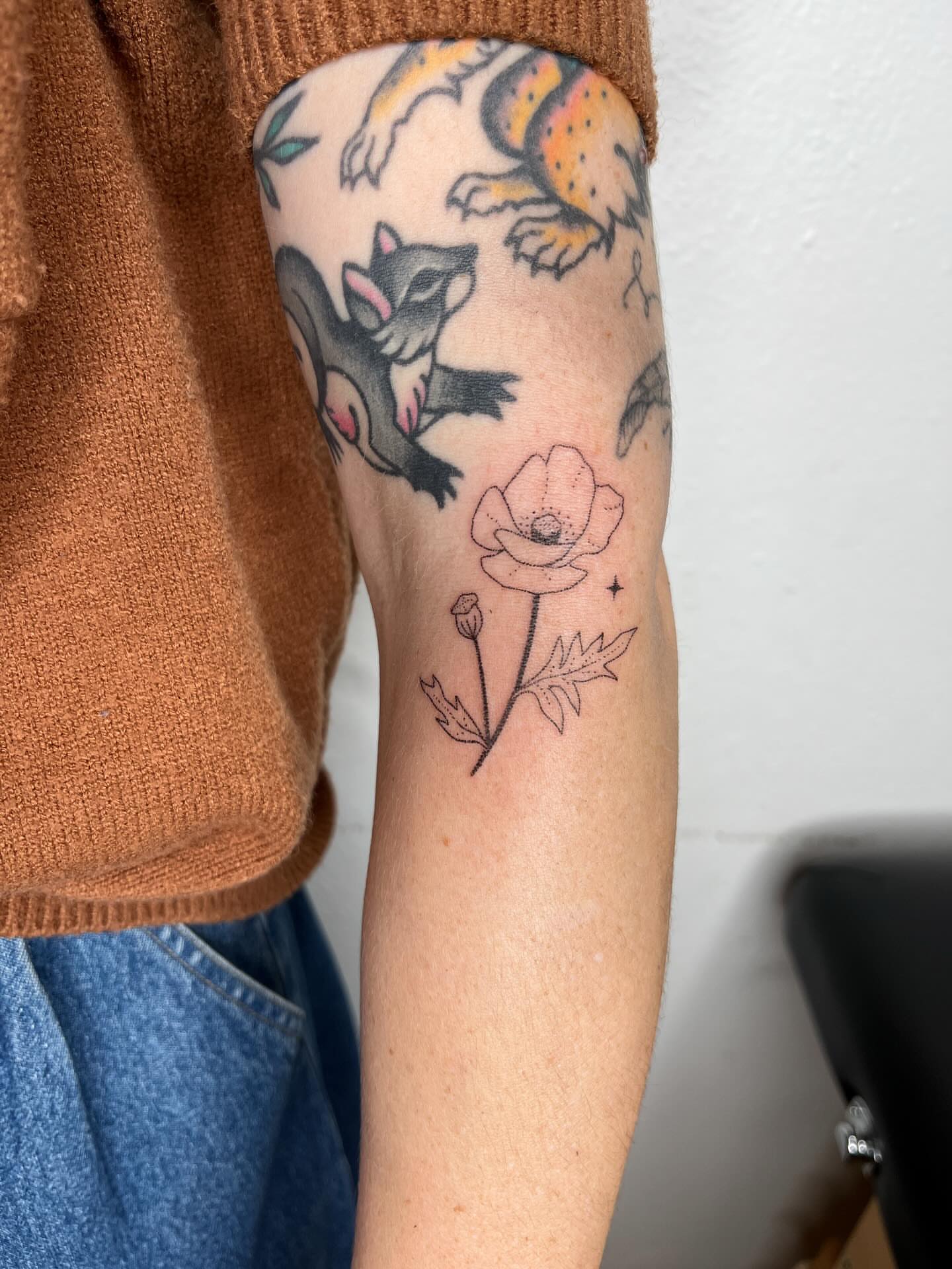 Fox and poppy American traditional tattoo on the forearm by natalie