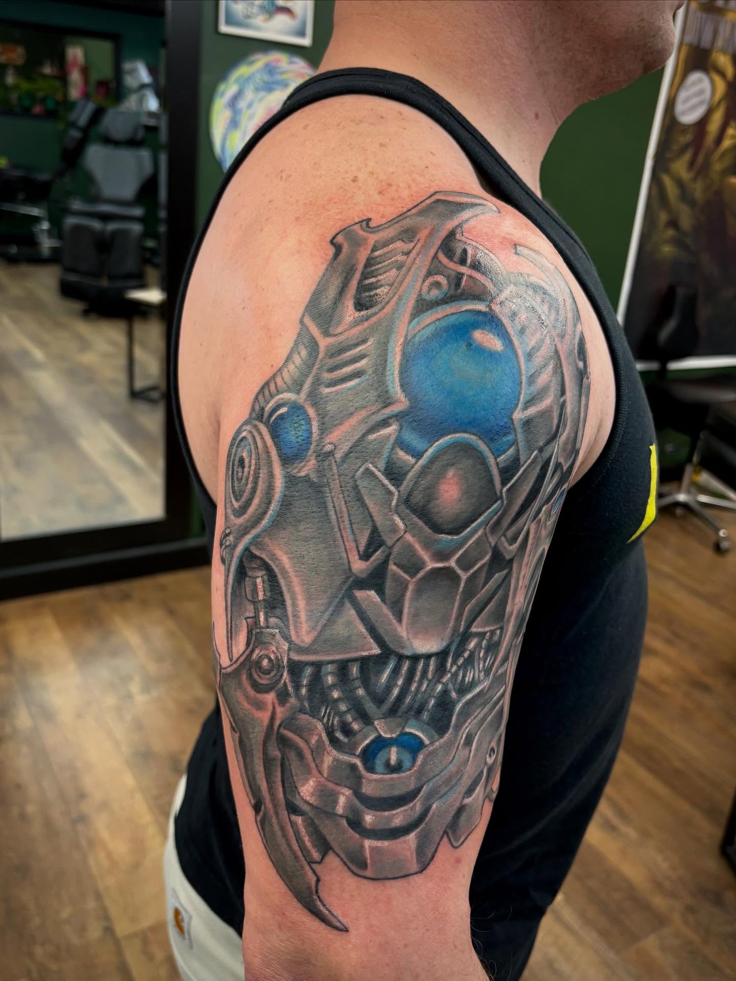 Mech head realism tattoo on the shoulder by Robbie Reel, Wichita, Kansas