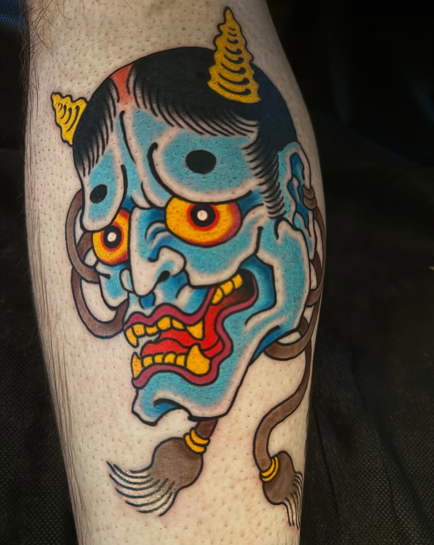 Demon mask American traditional tattoo on the forearm by Noah Moretz