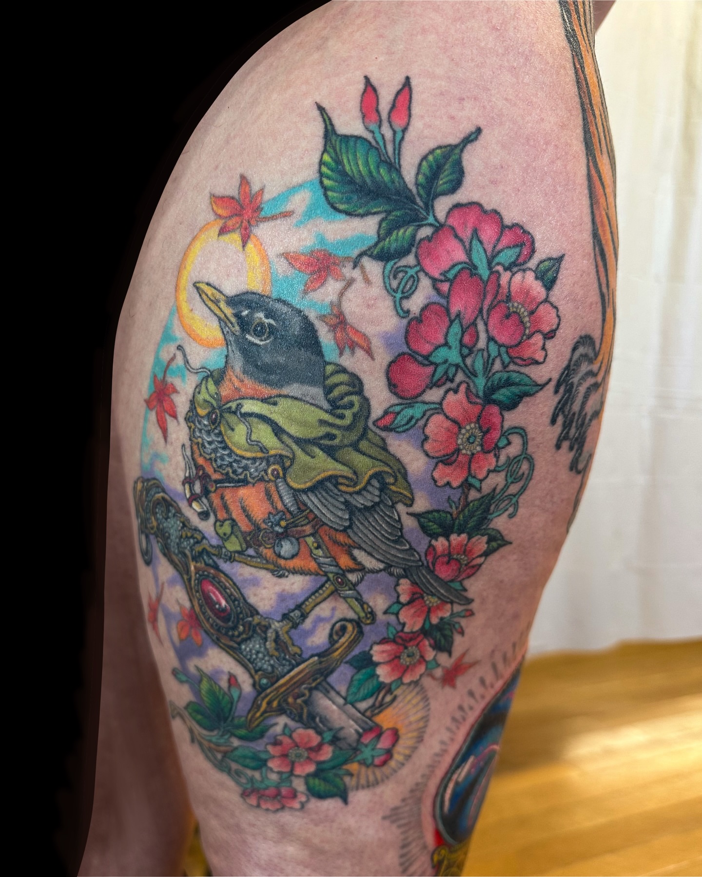 Bird and flowers American traditional tattoo on the thigh by Colin Kenji Baker, San Jose, California