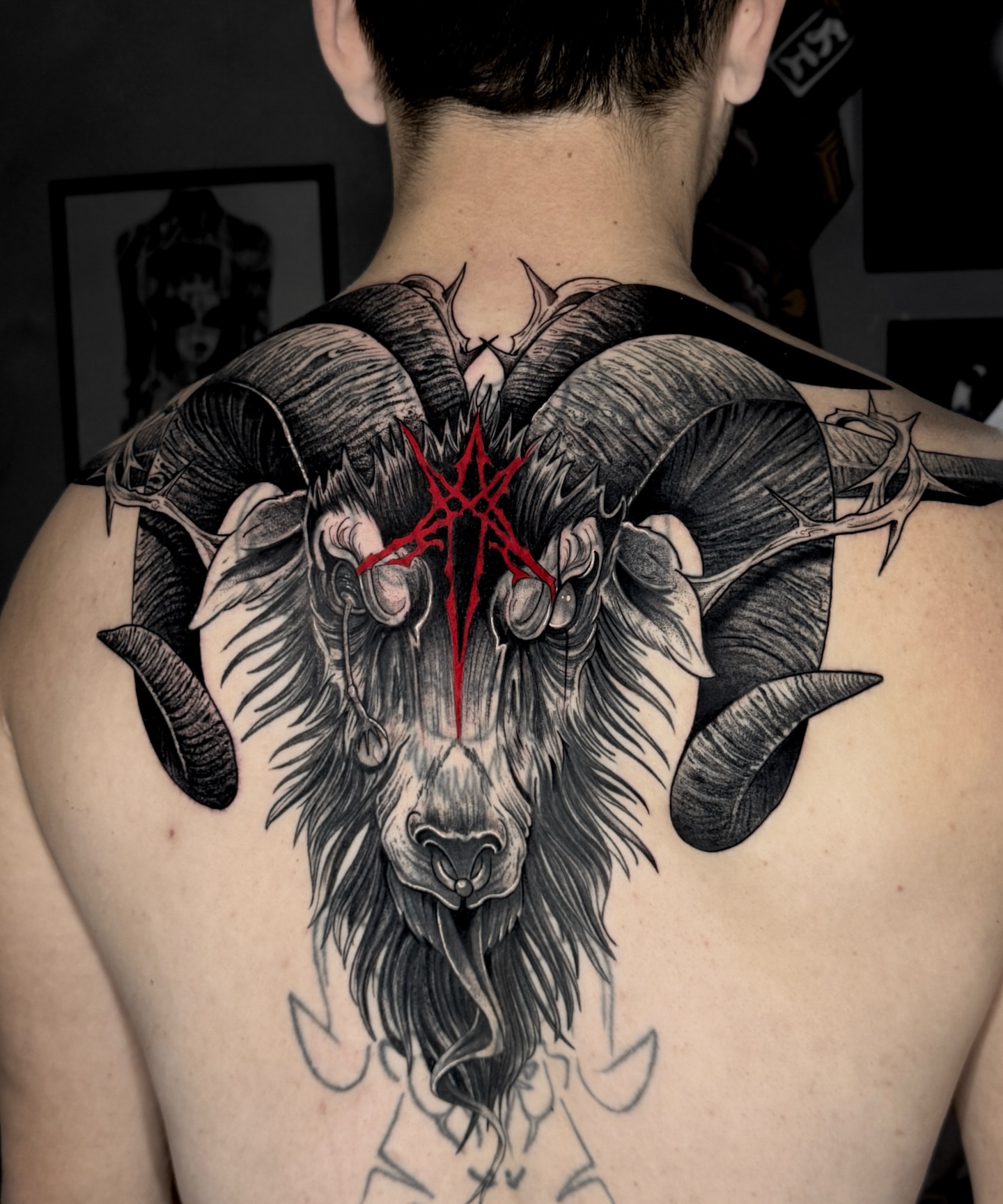 Ram head realism tattoo on the back by Stiven Gomez