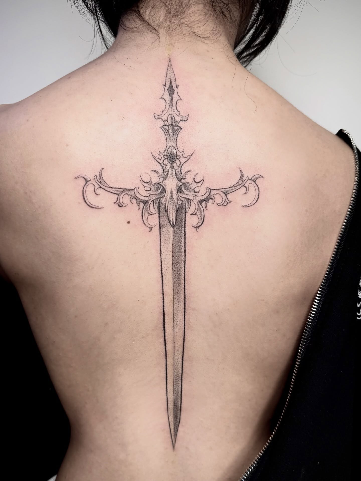 Sword dotwork tattoo on the back by Abrianna