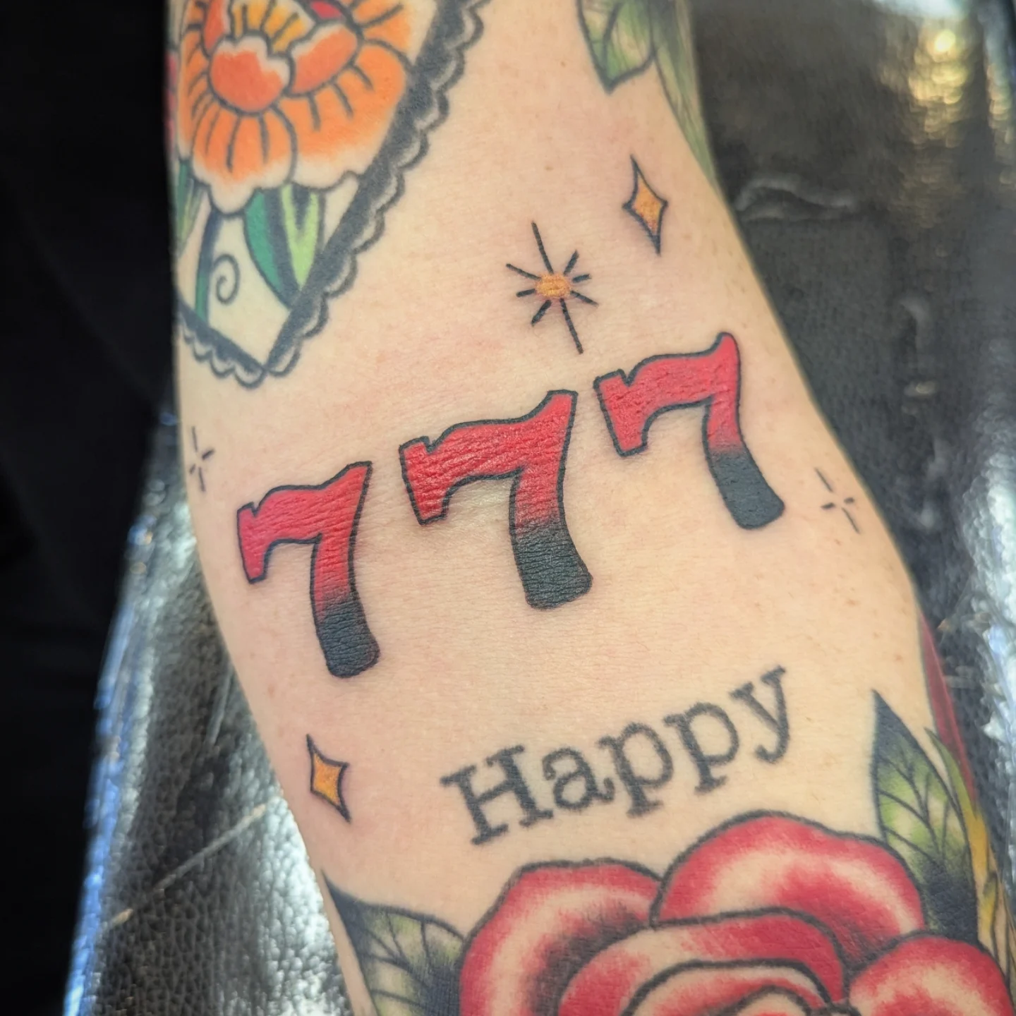 777 Happy American traditional tattoo on the forearm by ♡ Cora ♡