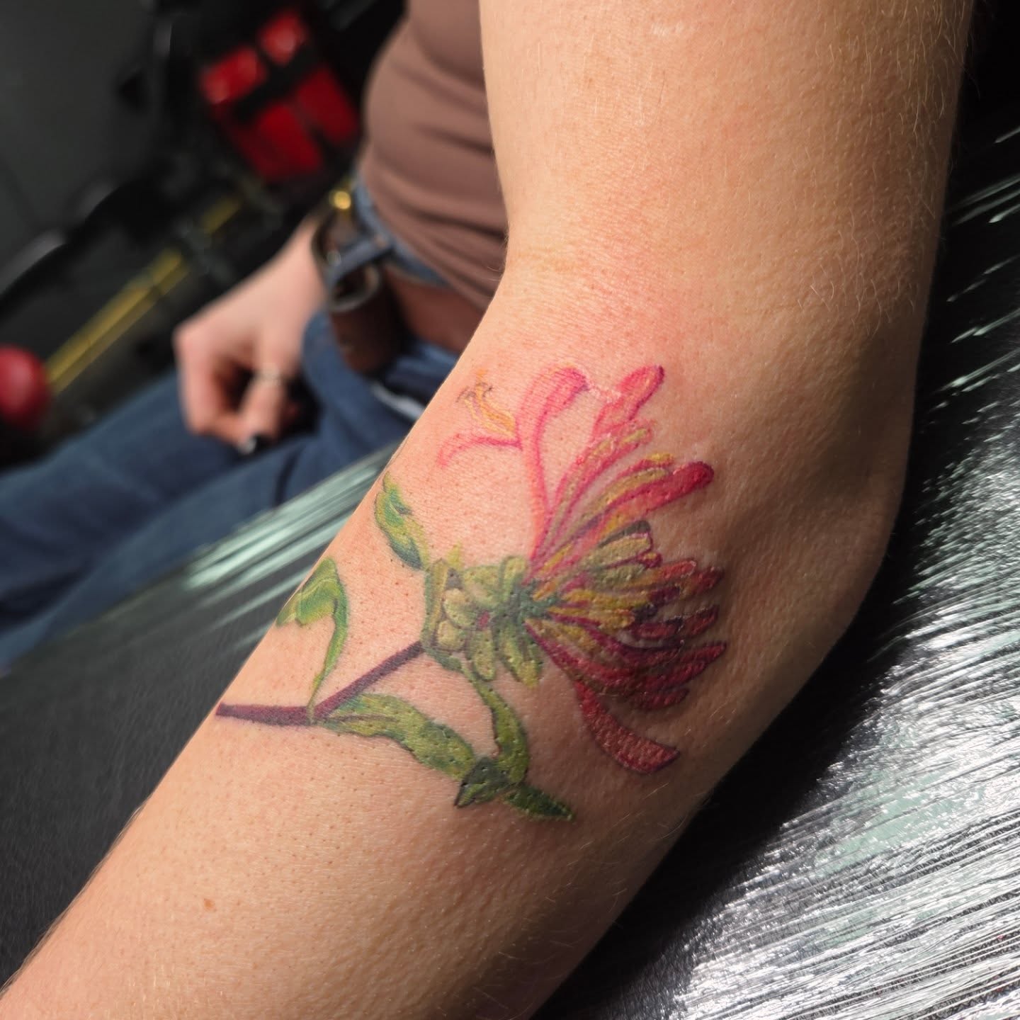 Flower realism tattoo on the forearm by Trinity Renee