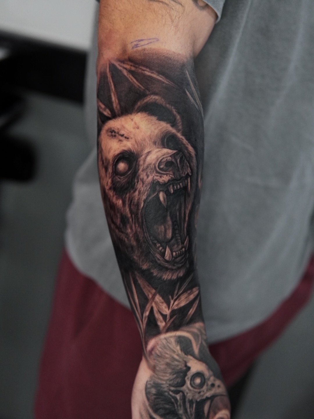 Bear skull realism tattoo on the forearm by Mia