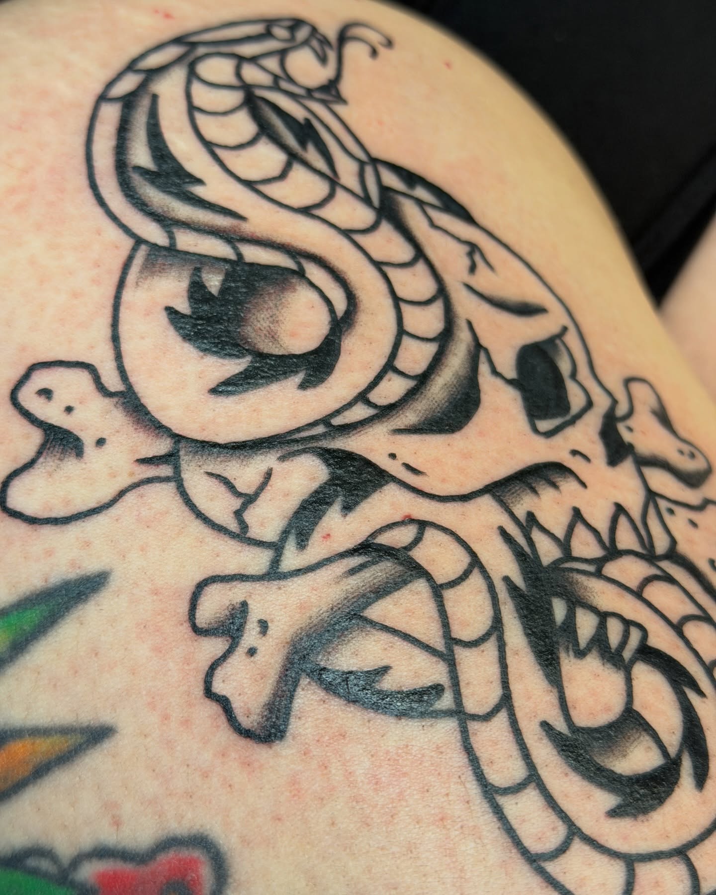 Snake and skull black and grey tattoo on the thigh by R e N O T