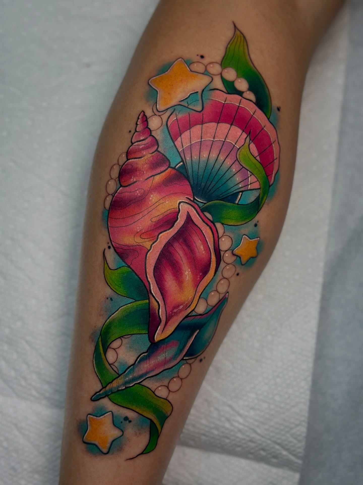 Seashells and pearls new school tattoo on the forearm by โ ๐ฟ๐๐ ๐ญ๐๐๐๐