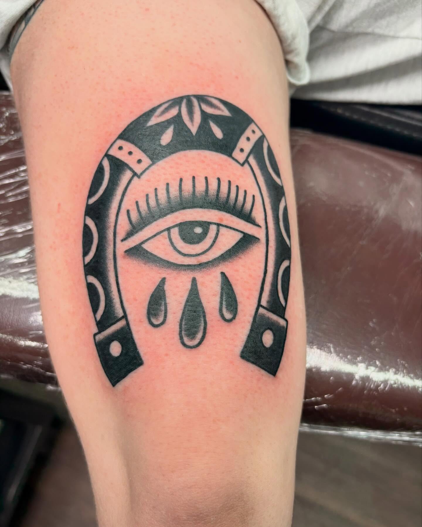 Eye within horseshoe black and grey tattoo on the forearm by ✨Shelby ✨