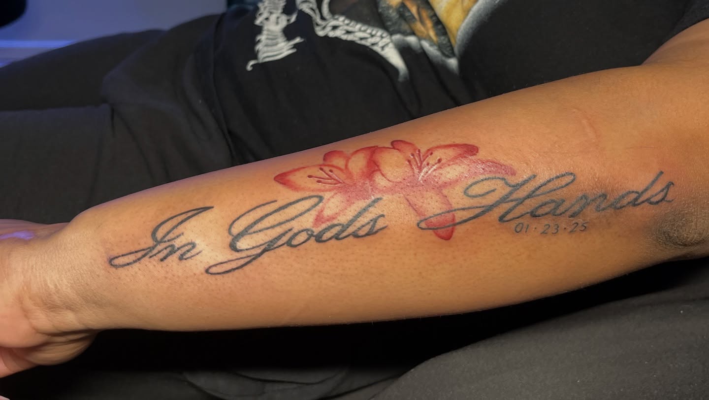Flowers and script lettering script tattoo on the forearm by Star Tattoos ⚜️