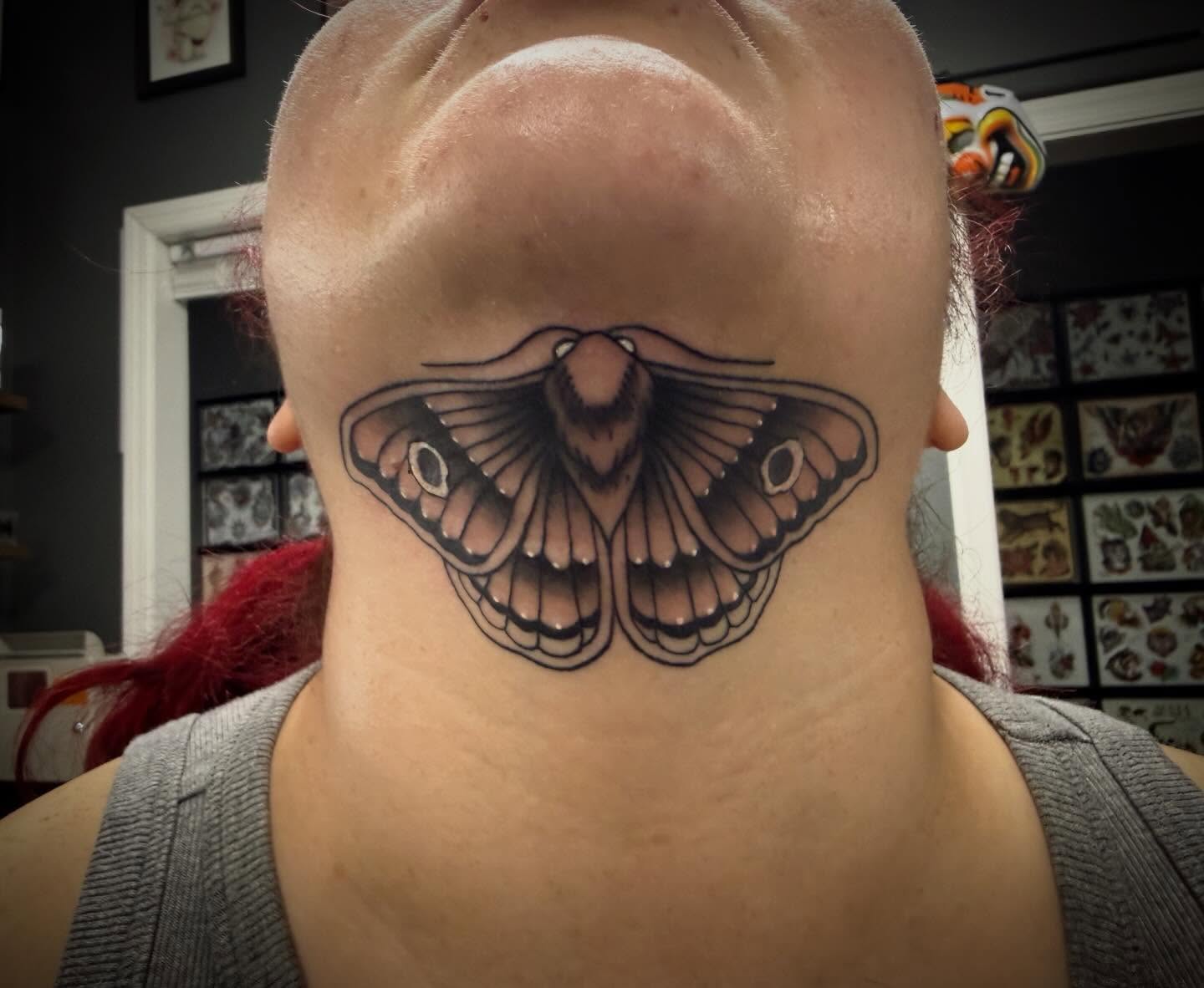 Moth realism tattoo on the neck by Abby Hofman