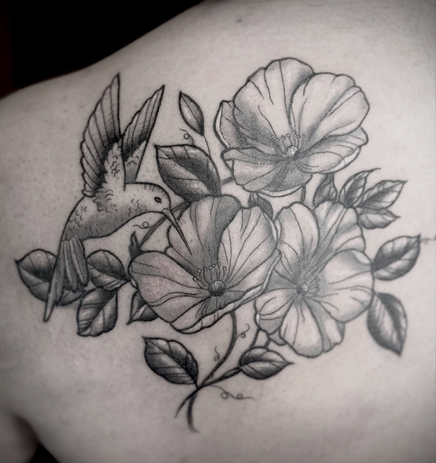 Flowers and hummingbird realism tattoo on the shoulder by Bronzino Ink - Karen, Asheville, North Carolina